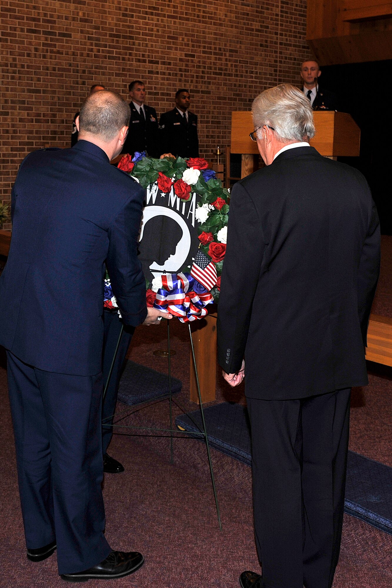 PETERSON AIR FORCE BASE, Colo. – Col. Douglas Schiess, 21st Space Wing commander (left) and retired Col. Paul Robinson, former POW and guest speaker, place the memorial wreath during the POW/MIA Remembrance Ceremony at the Peterson Chapel on Sept. 18. (U.S. Air Force photo by Dennis Howk)