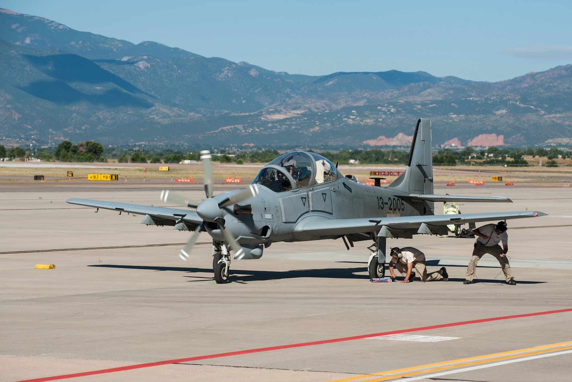 PETERSON AIR FORCE BASE, Colo. – Afghan maintainers check over an A-29B Super Tucano before taking off for high altitude training Sept. 16, 2015 in Colorado. Pilots with the 81st Fighter Squadron out of Moody Air Force Base, Ga. have been working with Afghan pilots since January and came to Peterson to train in the high altitude and mountainous terrain. After the Afghan pilot training is complete, they will go back to Afghanistan to establish their own fighter squadron based off the infrastructure of the US Air Force. (U.S. Air Force photo by Airman 1st Class Rose Gudex)