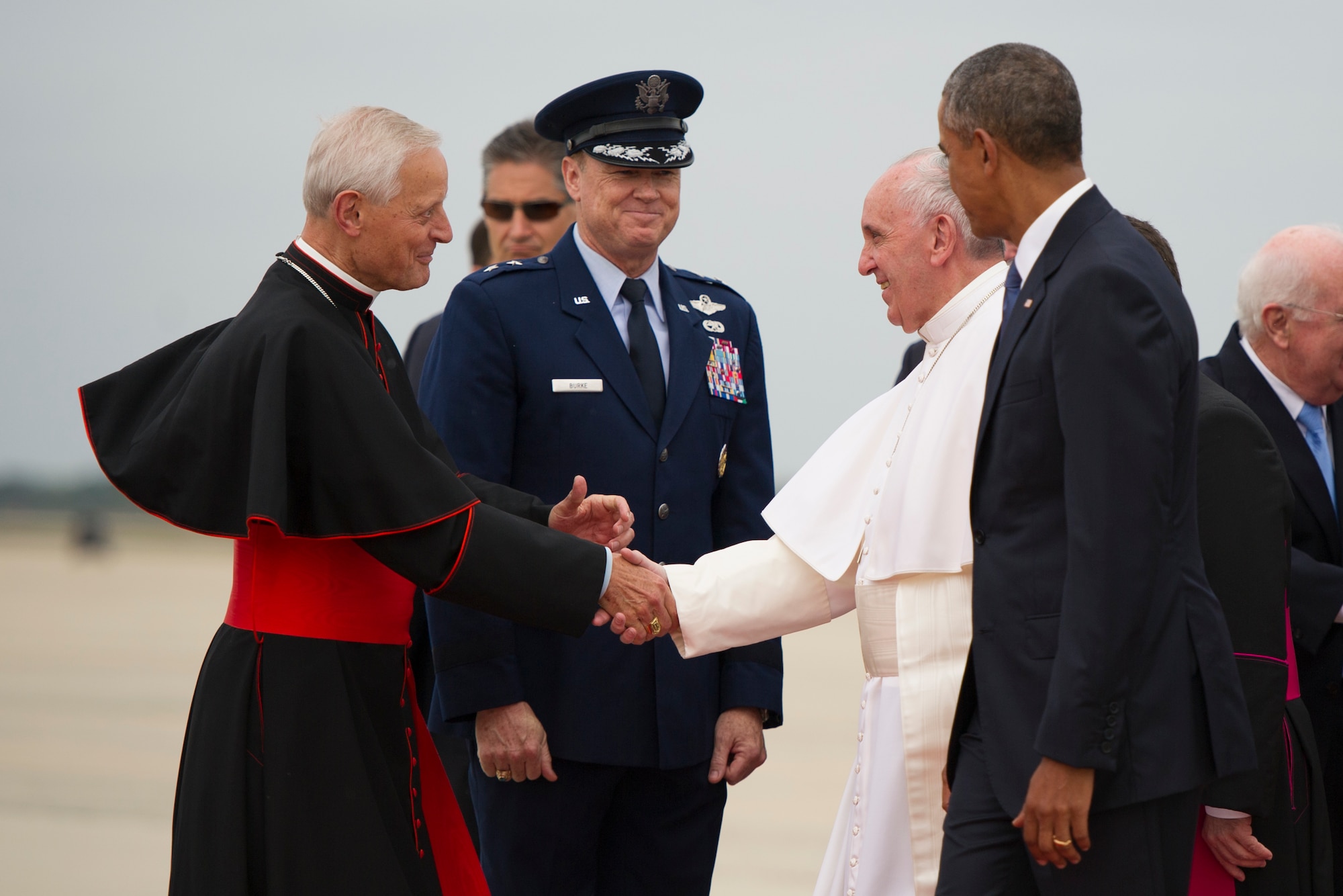 Pope Francis, escorted by President Barack Obama, greets Cardinal Donald W. Wuerl (left), Archbishop of Washington, and Maj. Gen. Darryl Burke, Air Force District of Washington commander, at Joint Base Andrews, Md., Sept. 22, 2015. This marks the first visit by the current pope to the United States. (U.S. Air Force photo/Tech. Sgt. Robert Cloys)