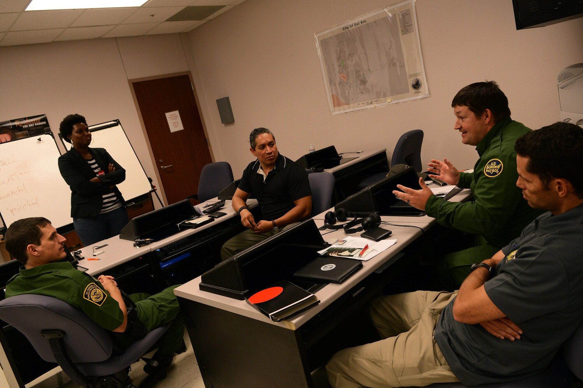 U.S. Customs and Border Protection chaplains exchange ideas at the CBP Del Rio Border Patrol Sector in Del Rio, Texas, Sept. 21, 2015. The group was instructed to discuss different scenarios and how they could be handled when dealing with depressed or suicidal individuals. (U.S. Air Force photo by Airman 1st Class Ariel D. Partlow) (Released)
