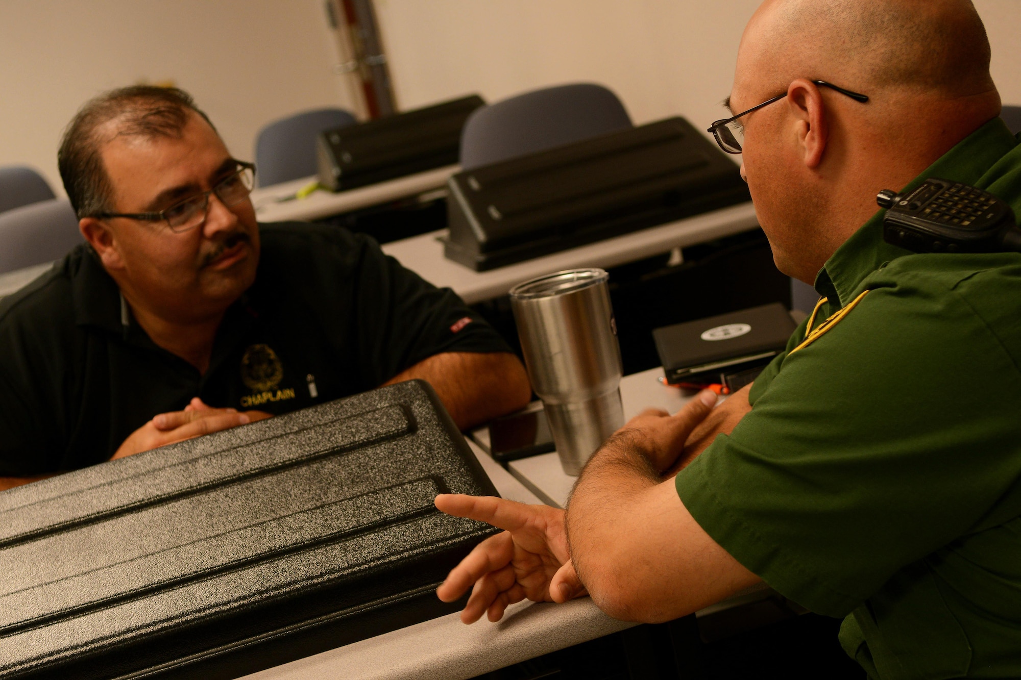 Two U.S. Customs and Border Protection chaplains exchange ideas at the CBP Del Rio Border Patrol Sector in Del Rio, Texas, Sept. 21, 2015. September, suicide prevention month, is the month that gives us the chance to recognize and educate the threat suicide poses to our society and how to cope with the feelings of depression, hopelessness and helplessness. (U.S. Air Force photo by Airman 1st Class Ariel D. Partlow) (Released)