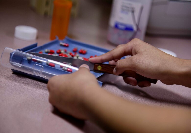 U.S. Air Force Airman 1st Class Veronique J. Cerda, 35th Medical Support Squadron pharmacy technician, counts medication at Misawa Air Base, Japan, Sept. 23, 2015. Cerda ensures Misawa Airmen and families are healthy and knowledgeable about prescribed medicine. (U.S. Air Force photo by Airman 1st Class Jordyn Fetter/Released)
