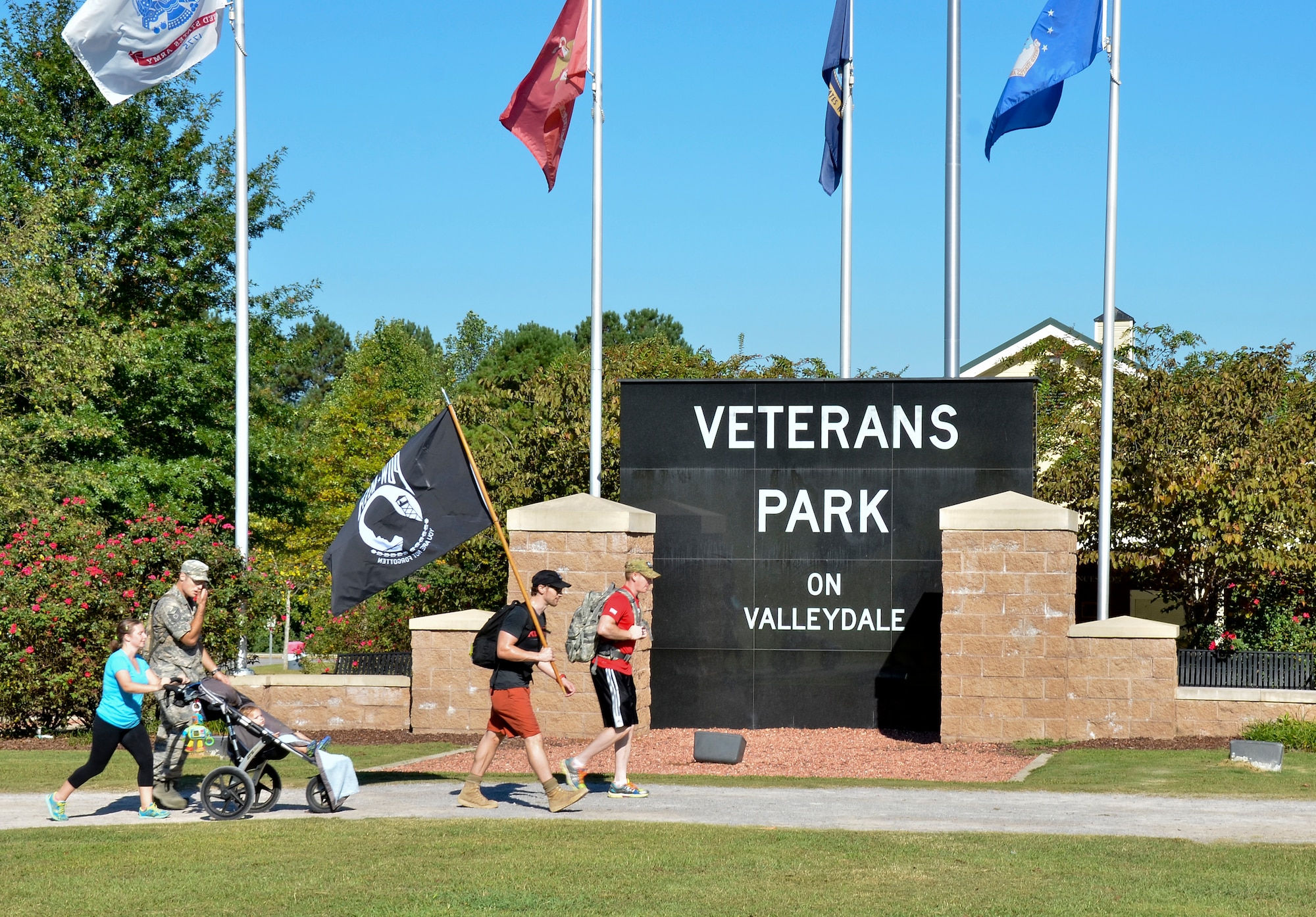 Tech Sgt. Matthew J. Crawford, 99th Air Refueling Squadron, plans and participates in the Prisoners of War/Missing in Action Recognition Day event on Sept. 18, 2015, at Veterans Park, Hoover, Ala.  Civilians and members of the Alabama National Guard walked to pay homage to POW/MIA. More than 83,000 Americans remain missing from conflicts beginning with World War II.  Each step of the approximate 16 mile walk symbolizes one missing American.  (U.S. Air National Guard photo by Staff Sgt. Jeremy Farson/Released)