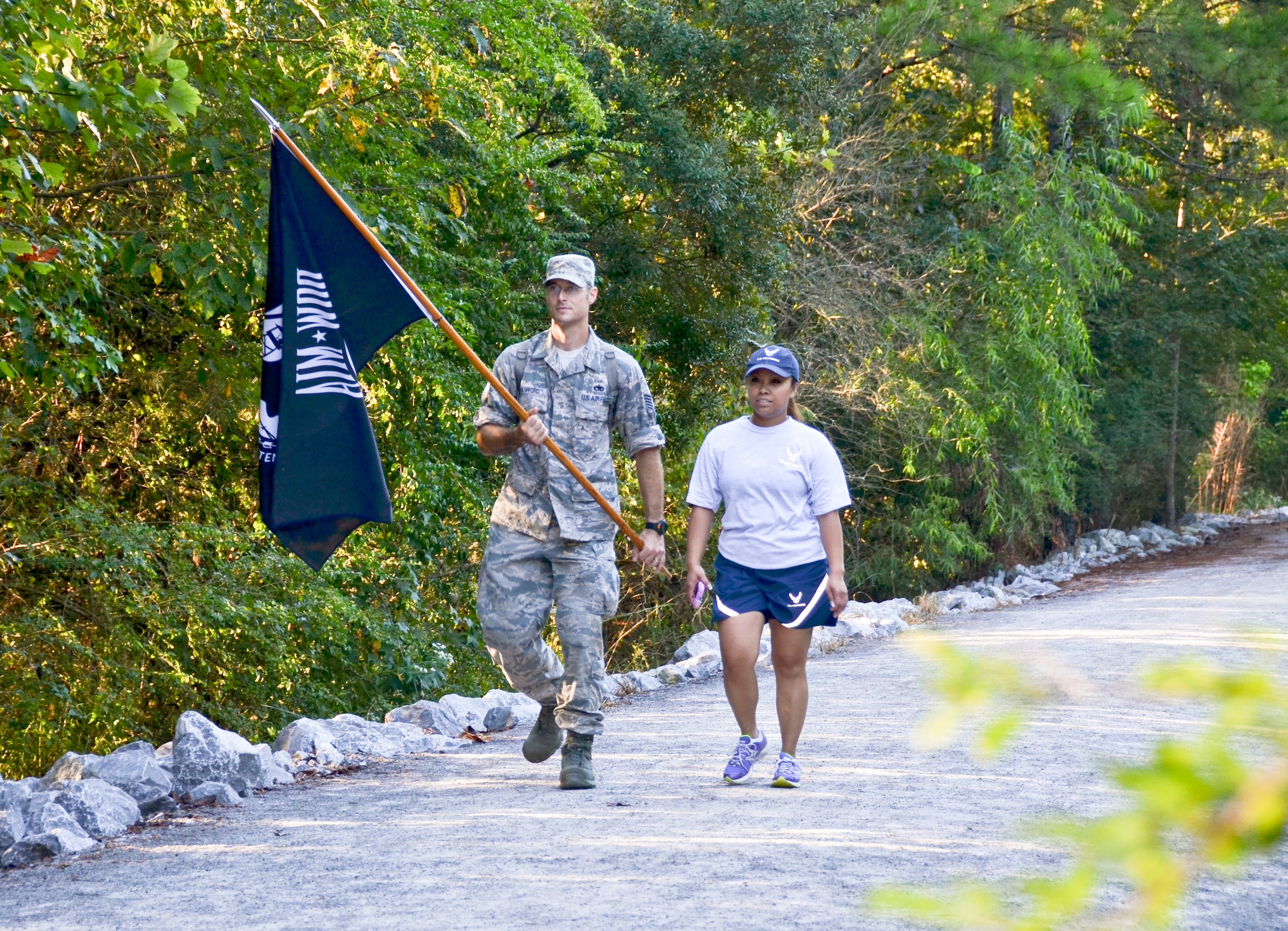 Tech Sgt. Matthew J. Crawford, 99th Air Refueling Squadron, plans and participates in the Prisoners of War/Missing in Action Recognition Day event on Sept. 18, 2015, at Veterans Park, Hoover, Ala.  Civilians and members of the Alabama National Guard walked to pay homage to POW/MIA. More than 83,000 Americans remain missing from conflicts beginning with World War II.  Each step of the approximate 16 mile walk symbolizes one missing American.  (U.S. Air National Guard photo by Staff Sgt. Jeremy Farson/Released)