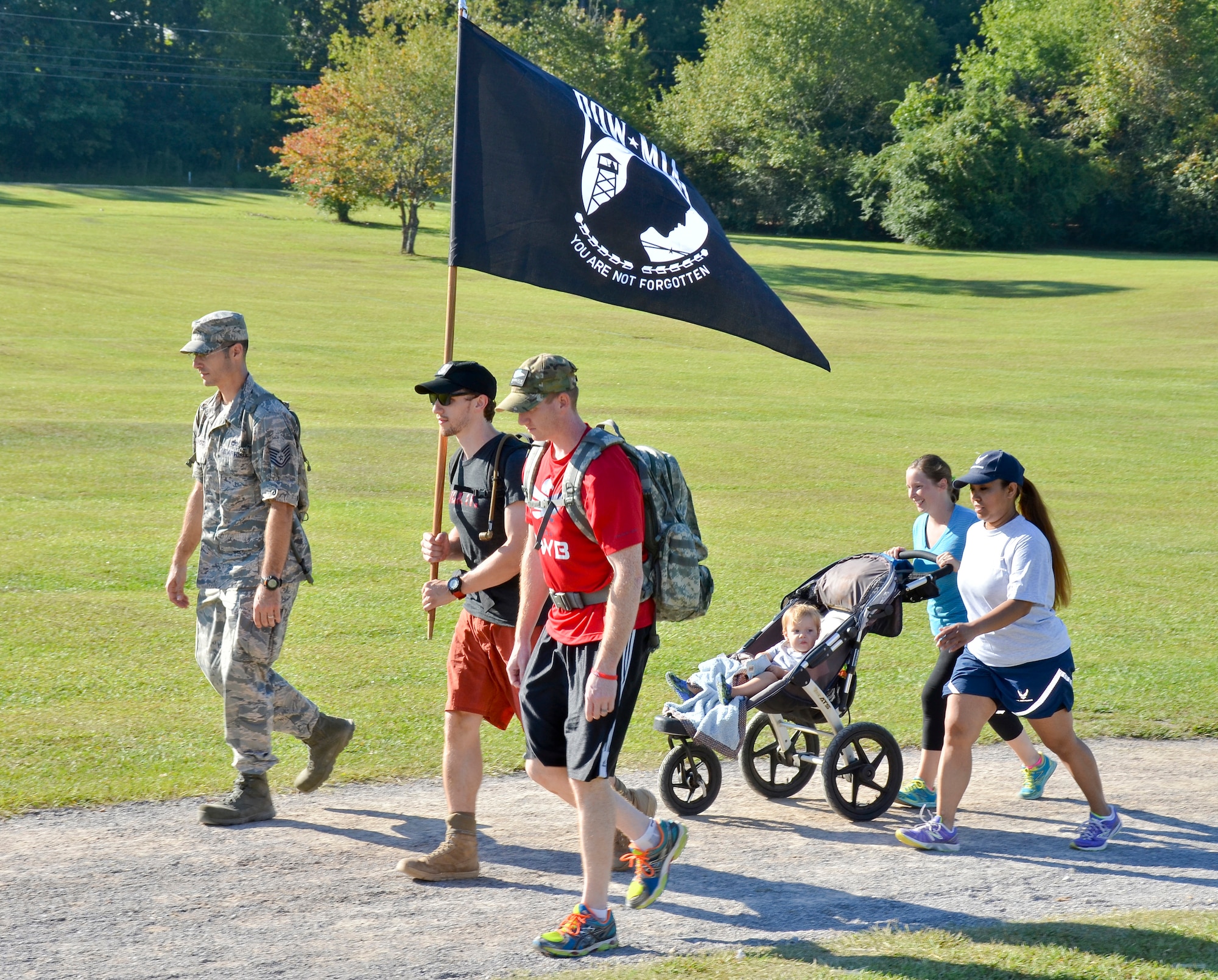 Tech Sgt. Matthew J. Crawford, 99th Air Refueling Squadron, plans and participates in the Prisoners of War/Missing in Action Recognition Day event on Sept. 18, 2015, at Veterans Park, Hoover, Ala.  Civilians and members of the Alabama National Guard walked to pay homage to POW/MIA. More than 83,000 Americans remain missing from conflicts beginning with World War II.  Each step of the approximate 16 mile walk symbolizes one missing American.  (U.S. Air National Guard photo by Staff Sgt. Jeremy Farson/Released)
