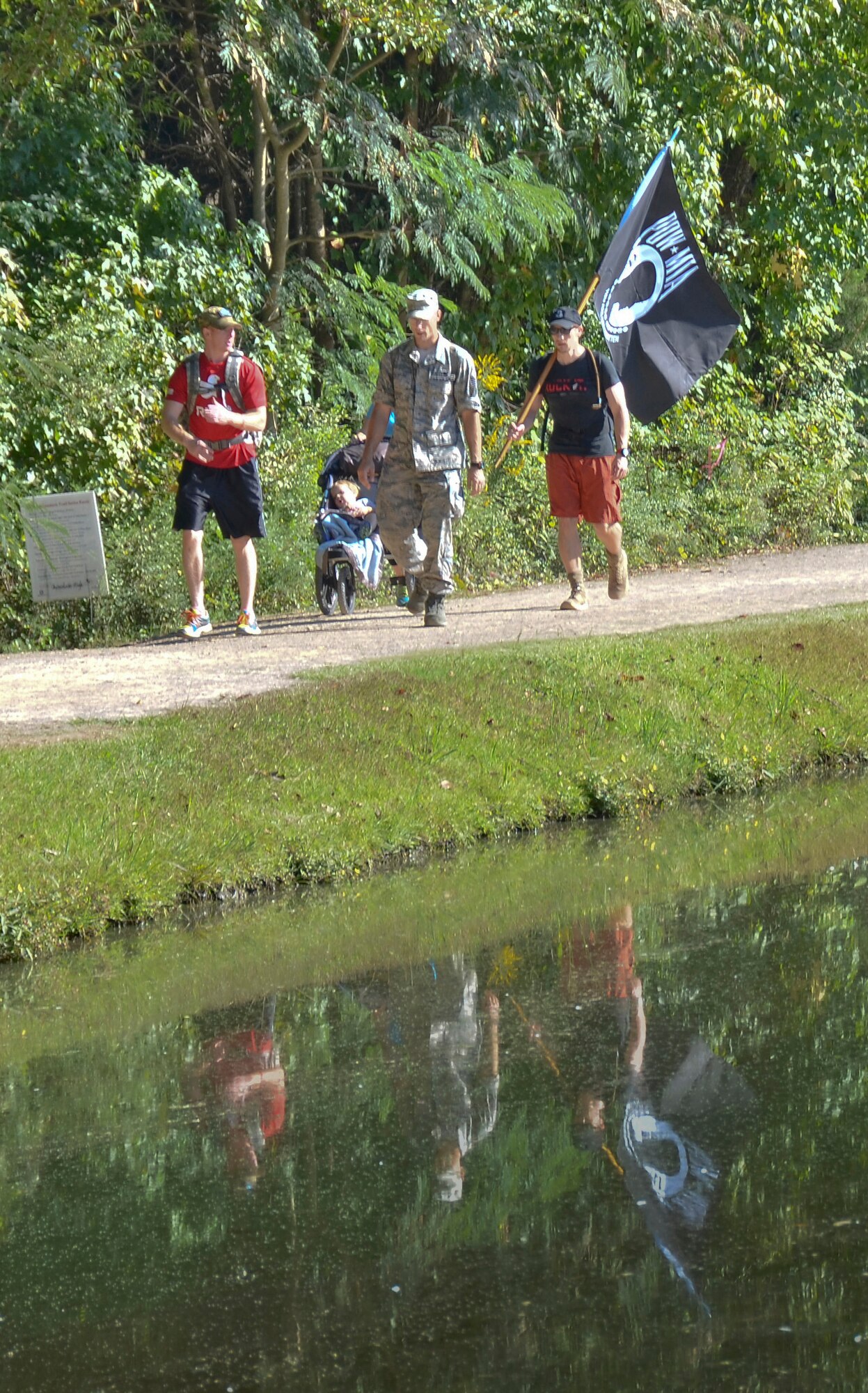 Tech Sgt. Matthew J. Crawford, 99th Air Refueling Squadron, plans and participates in the Prisoners of War/Missing in Action Recognition Day event on Sept. 18, 2015, at Veterans Park, Hoover, Ala.  Civilians and members of the Alabama National Guard walked to pay homage to POW/MIA. More than 83,000 Americans remain missing from conflicts beginning with World War II.  Each step of the approximate 16 mile walk symbolizes one missing American.  (U.S. Air National Guard photo by Staff Sgt. Jeremy Farson/Released)