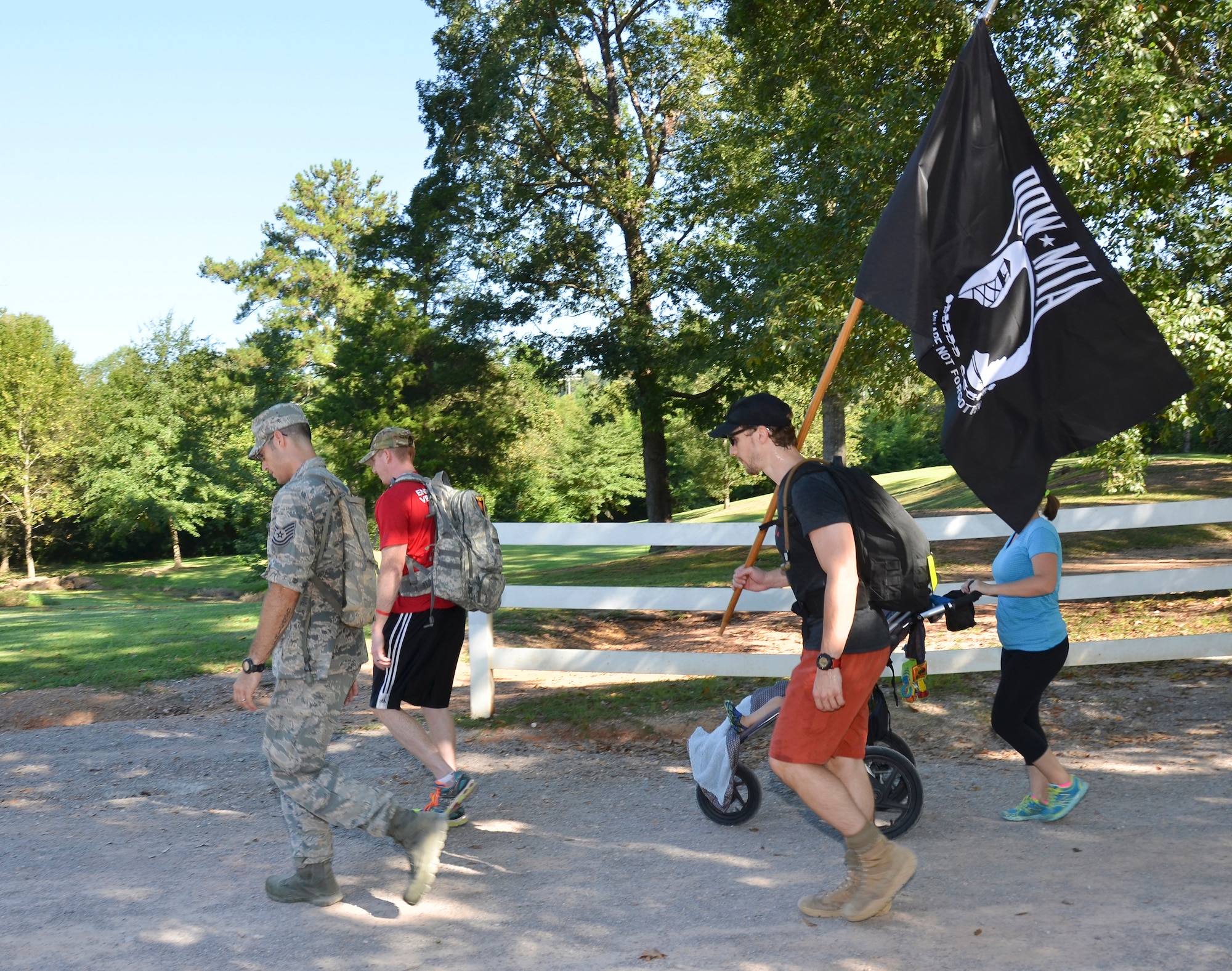 Tech Sgt. Matthew J. Crawford, 99th Air Refueling Squadron, plans and participates in the Prisoners of War/Missing in Action Recognition Day event on Sept. 18, 2015, at Veterans Park, Hoover, Ala.  Civilians and members of the Alabama National Guard walked to pay homage to POW/MIA. More than 83,000 Americans remain missing from conflicts beginning with World War II.  Each step of the approximate 16 mile walk symbolizes one missing American.  (U.S. Air National Guard photo by Staff Sgt. Jeremy Farson/Released)