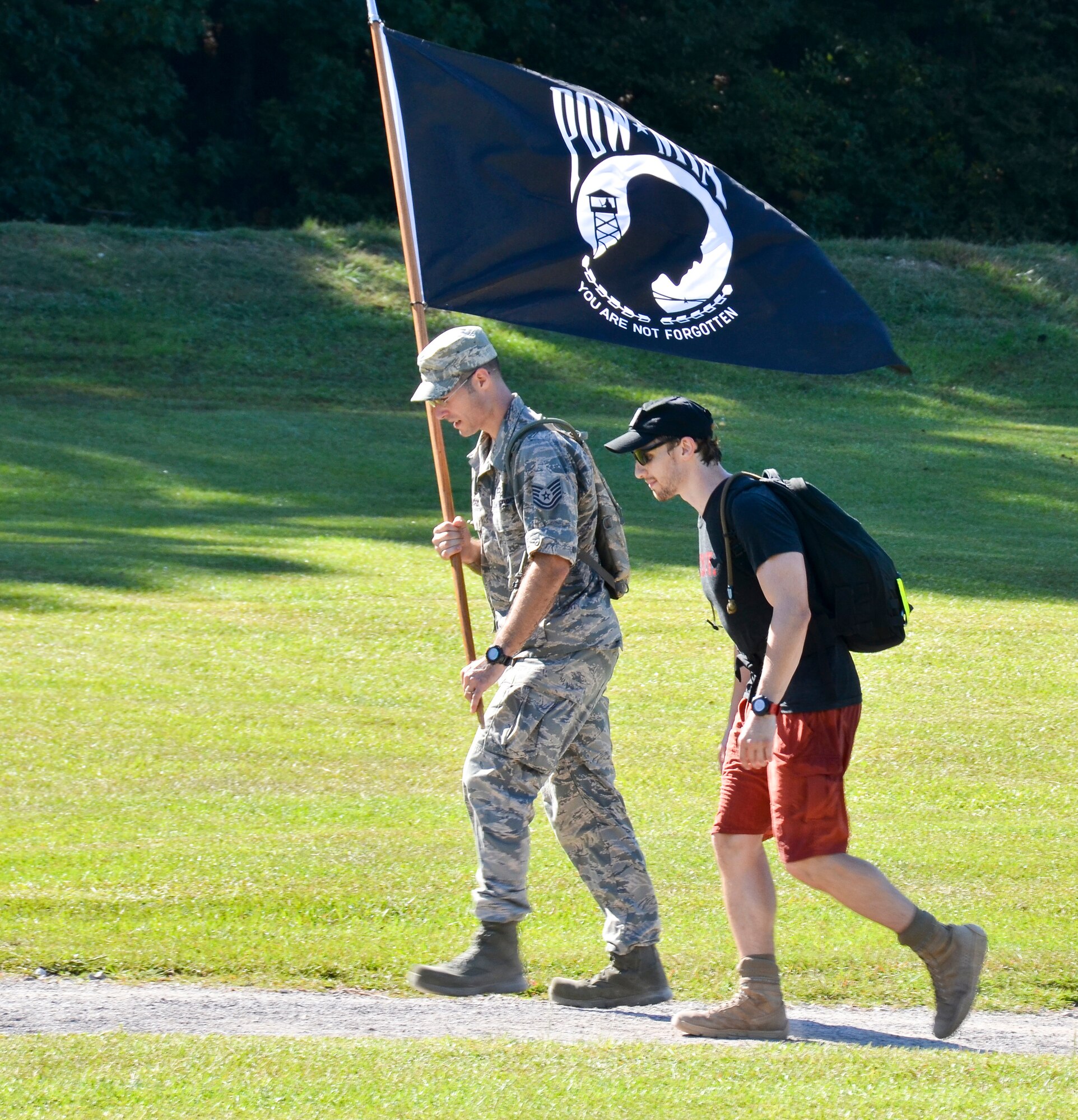 Tech Sgt. Matthew J. Crawford, 99th Air Refueling Squadron, plans and participates in the Prisoners of War/Missing in Action Recognition Day event on Sept. 18, 2015, at Veterans Park, Hoover, Ala.  Civilians and members of the Alabama National Guard walked to pay homage to POW/MIA. More than 83,000 Americans remain missing from conflicts beginning with World War II.  Each step of the approximate 16 mile walk symbolizes one missing American.  (U.S. Air National Guard photo by Staff Sgt. Jeremy Farson/Released)