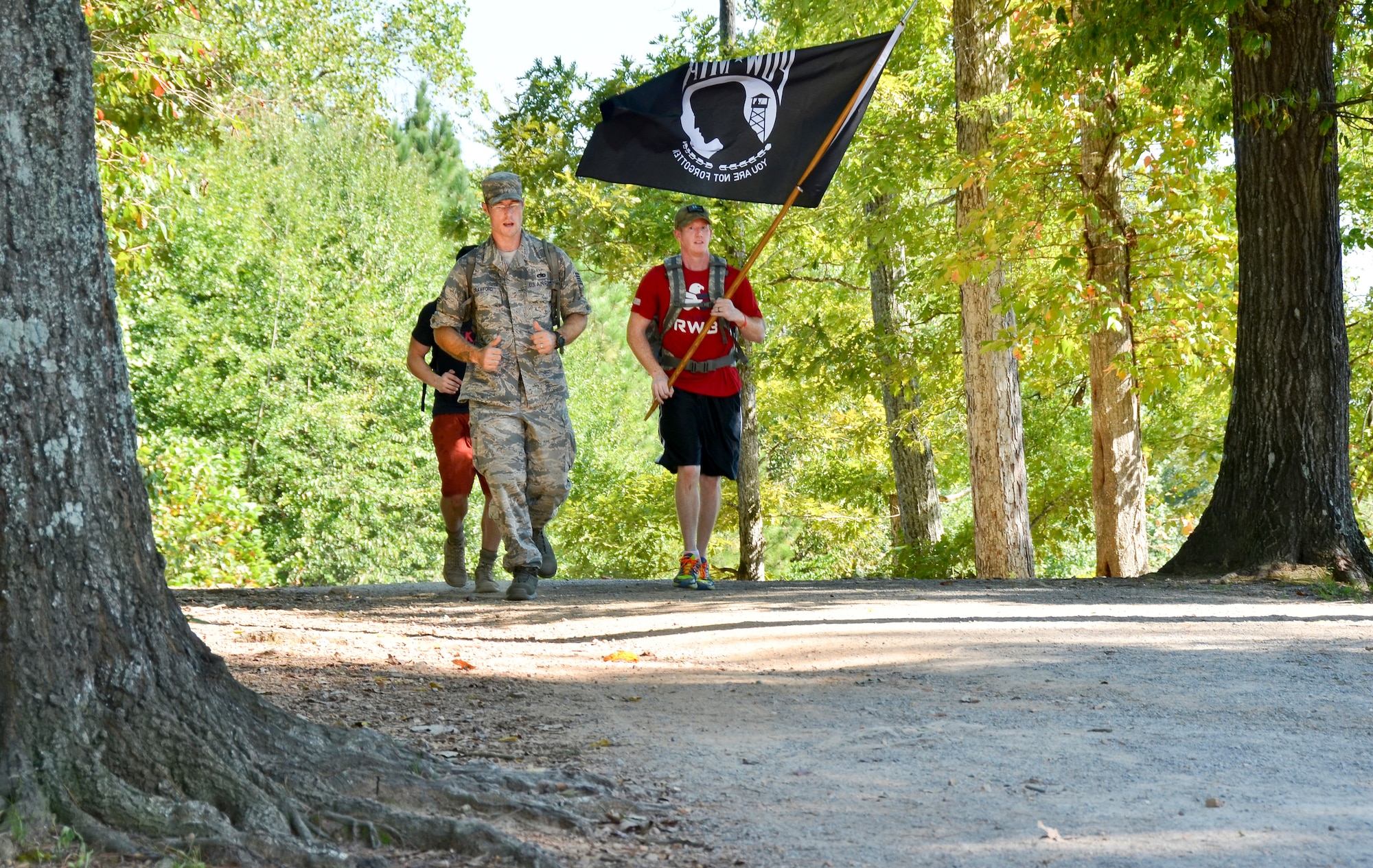 Tech Sgt. Matthew J. Crawford, 99th Air Refueling Squadron, plans and participates in the Prisoners of War/Missing in Action Recognition Day event on Sept. 18, 2015, at Veterans Park, Hoover, Ala.  Civilians and members of the Alabama National Guard walked to pay homage to POW/MIA. More than 83,000 Americans remain missing from conflicts beginning with World War II.  Each step of the approximate 16 mile walk symbolizes one missing American.  (U.S. Air National Guard photo by Staff Sgt. Jeremy Farson/Released)