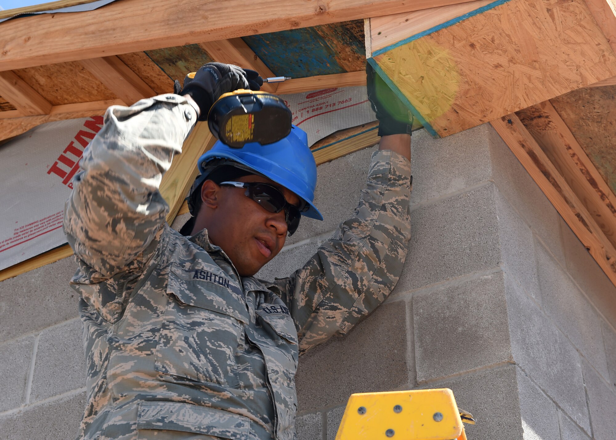 ALTUS AIR FORCE BASE, Okla. – U.S. Air Force Airman 1st Class LeAnthony Ashton, 433rd Civil Engineer Squadron, structures apprentice, Lackland Air Force Base, Texas, installs roof soffits during construction of a new entomology facility, Sept. 21, 2015. This project fulfills the annual 97th Civil Engineer Squadron requirement for contingency training as well as provides the entomology shop with a structure that is up to code. (U.S. Air Force photo by Airman 1st Class Megan E. Acs/Released)