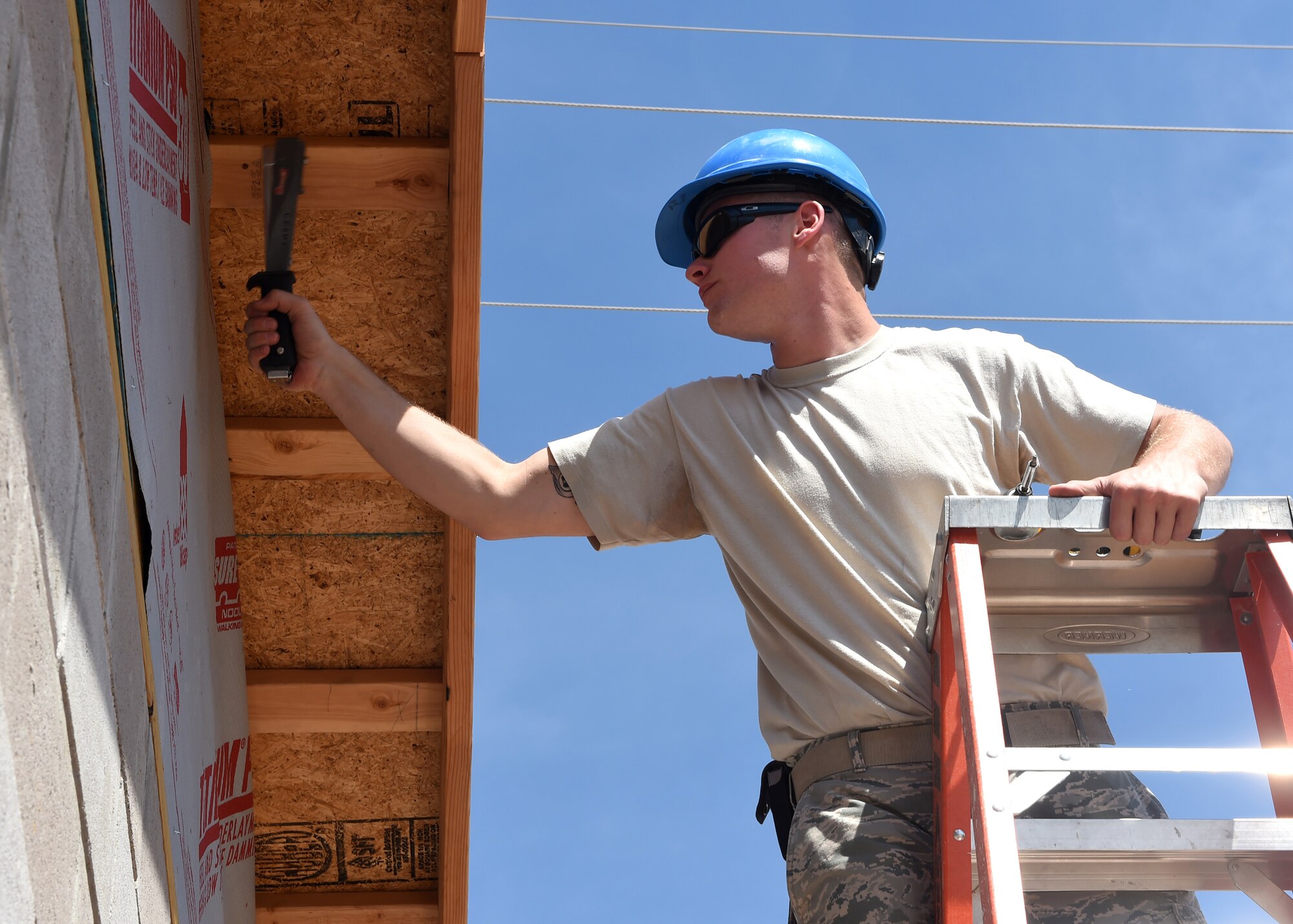 ALTUS AIR FORCE BASE, Okla. – U.S. Air Force Senior Airman Larry Finch, 97th Civil Engineer Squadron structural journeyman,  staples down underlayment during construction of a new entomology structure, Sept. 21, 2015. This project allows the Airmen from the 97th CES to receive hands on training they might not get during normal daily operations. (U.S. Air Force photo by Airman 1st Class Megan E. Acs/Released)