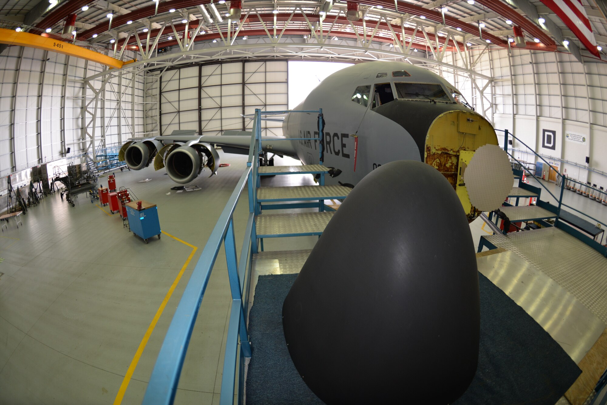 A KC-135 Stratotanker sits in a hangar as it undergoes a full isochronal inspection Sept. 11, 2015, on RAF Mildenhall, England. The tail was also removed in order to repair a cracked rudder on the jet, formerly from McConnell Air Force Base, as it becomes part of RAF Mildenhall’s fleet of refuelers. (U.S. Air Force photo by Karen Abeyasekere/Released) 