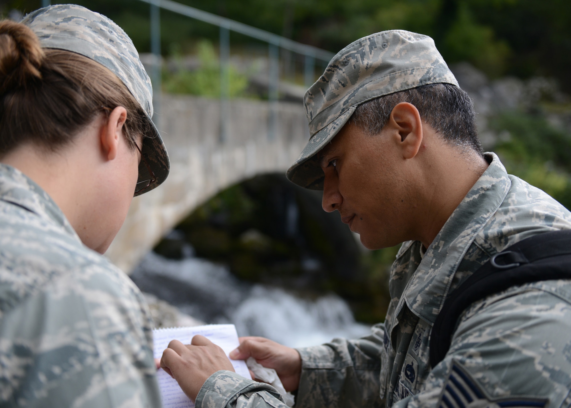 (Left) U.S. Air Force Airman 1st Class Aline Lentini, 52nd Medical
Group Bioenvironmental Engineering technician and Tech. Sgt. Luis Hernandez,
48th Medical Group Bioenvironmental Engineering technician, review notes
after inspecting a water treatment facility, during the U.S. Air Forces
Expeditionary Medical Support training Sept. 18, 2015 in Vipava, Slovenia.
The training is part of a 13-day multinational, tactical field training
exercise, Immediate Response 15. The exercise is designed to allow partner
nations and U.S. military services to improve NATO interoperability and
regional security. (Photo by U.S. Air Force Tech. Sgt. Eric Donner/Released)