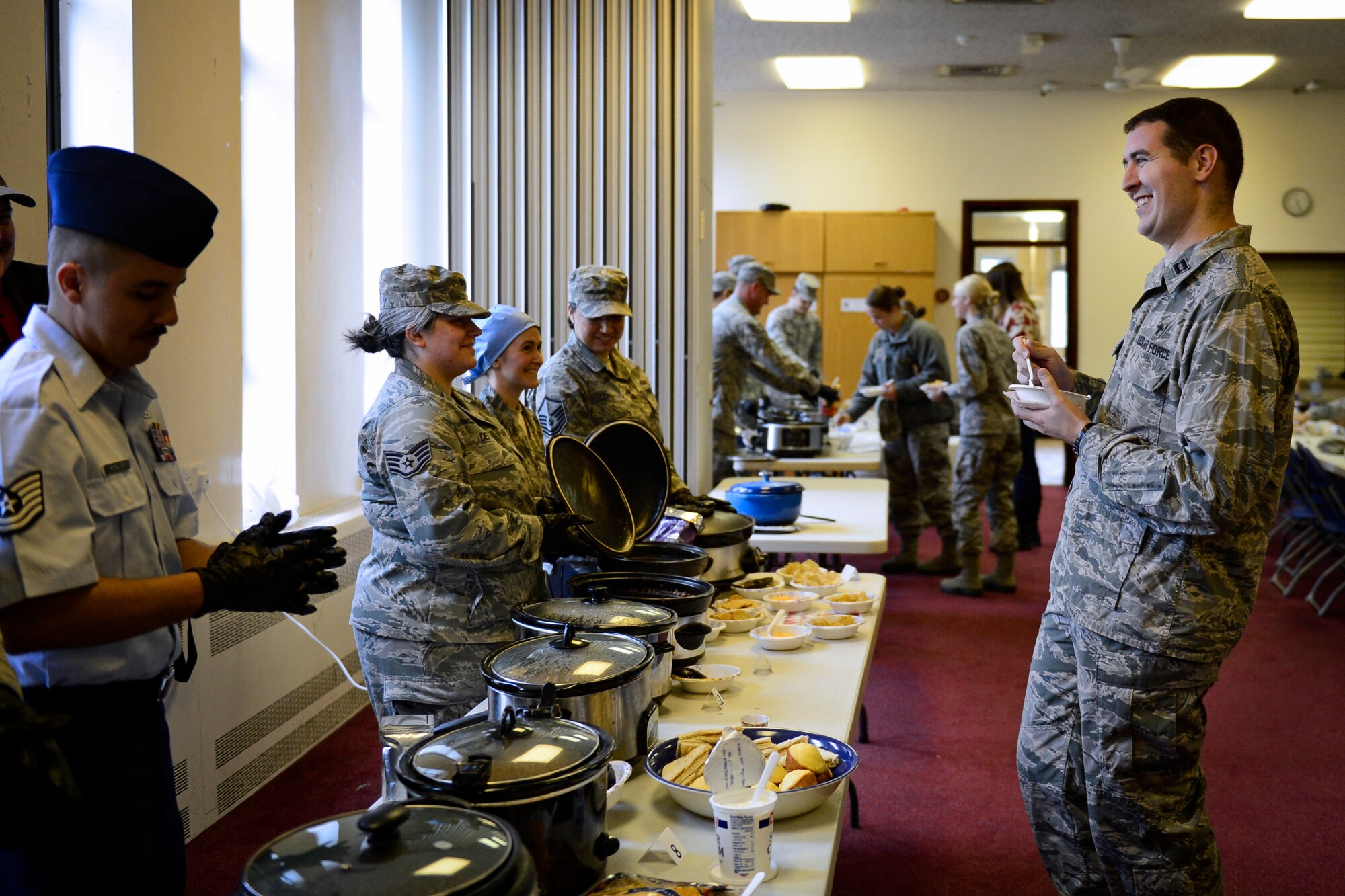 Capt. Matthew Knight, 48th Fighter Wing chaplain, tastes the different batches of chili at the Combined Federal Campaign Chili Cook-off event at Royal Air Force Lakenheath, England, Sept. 21, 2015. The purpose of the campaign is to raise funds for charitable organizations. (U.S. Air Force photo by Airman 1st Class Erin R. Babis/Released)  
