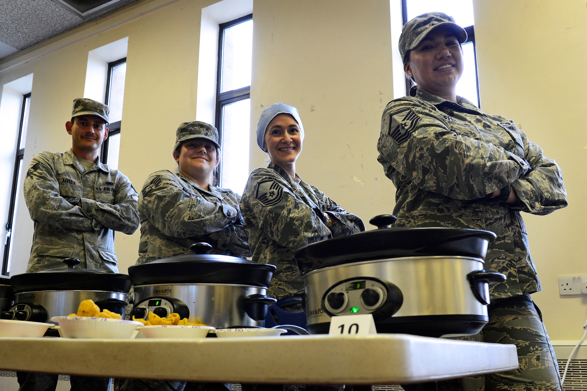 Participants pose with their slow cookers full of chili at the Combined Federal Campaign Chili Cook-off event at Royal Air Force Lakenheath, England, Sept. 21, 2015. The purpose of the campaign is to raise funds for charitable organizations. (U.S. Air Force photo by Airman 1st Class Erin R. Babis/Released) 