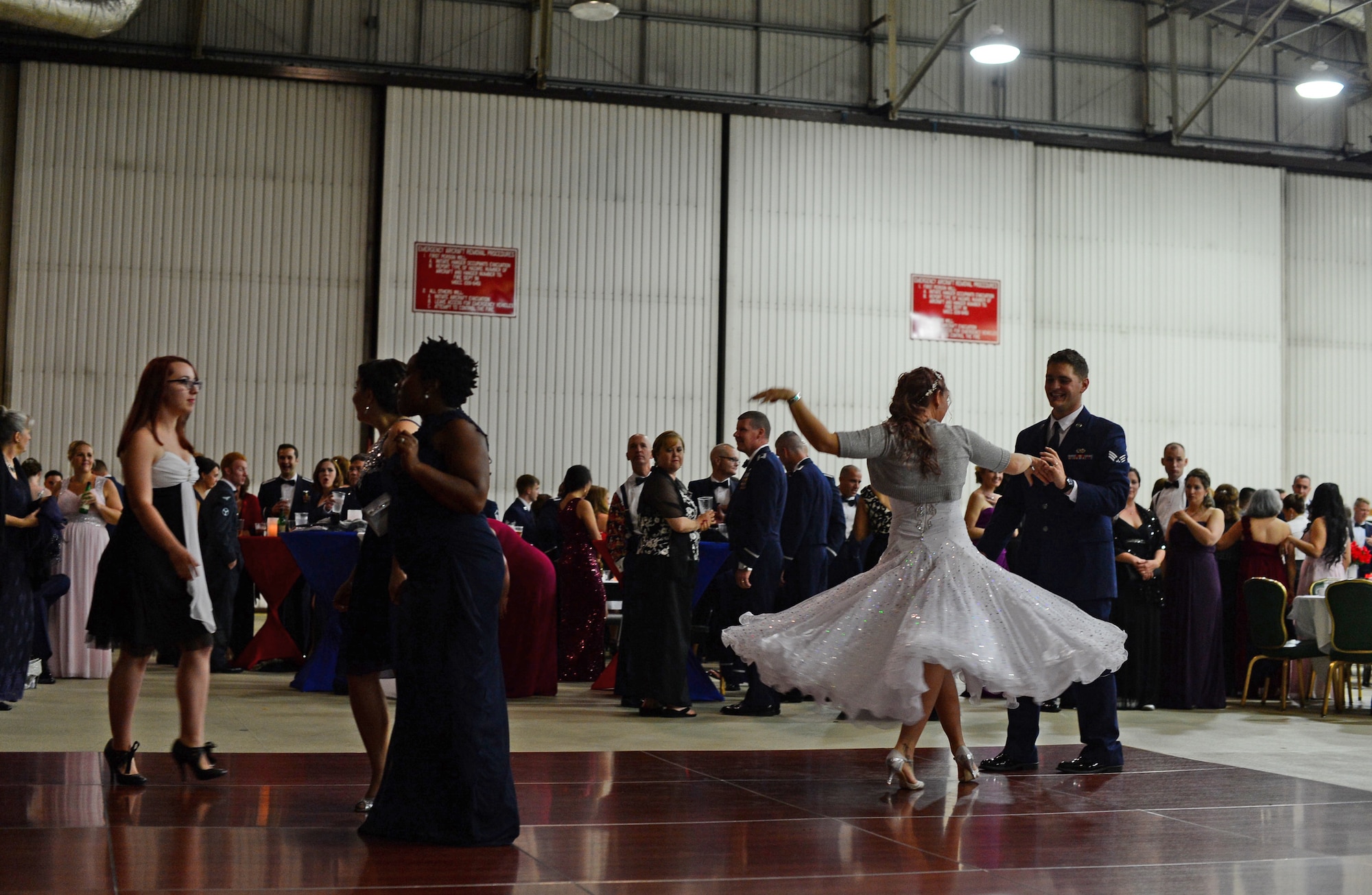 Spouses and Airmen from Royal Air Forces Lakenheath and Mildenhall dance at the Air Force Ball on RAF Lakenheath, England, Sept. 18, 2015. The celebration consisted of a presentation of the colors, the playing and singing of the U.K. and U.S. national anthems, social hour and a cake-cutting ceremony. (U.S. Air Force photo by Senior Airman Erin O’Shea/Released)