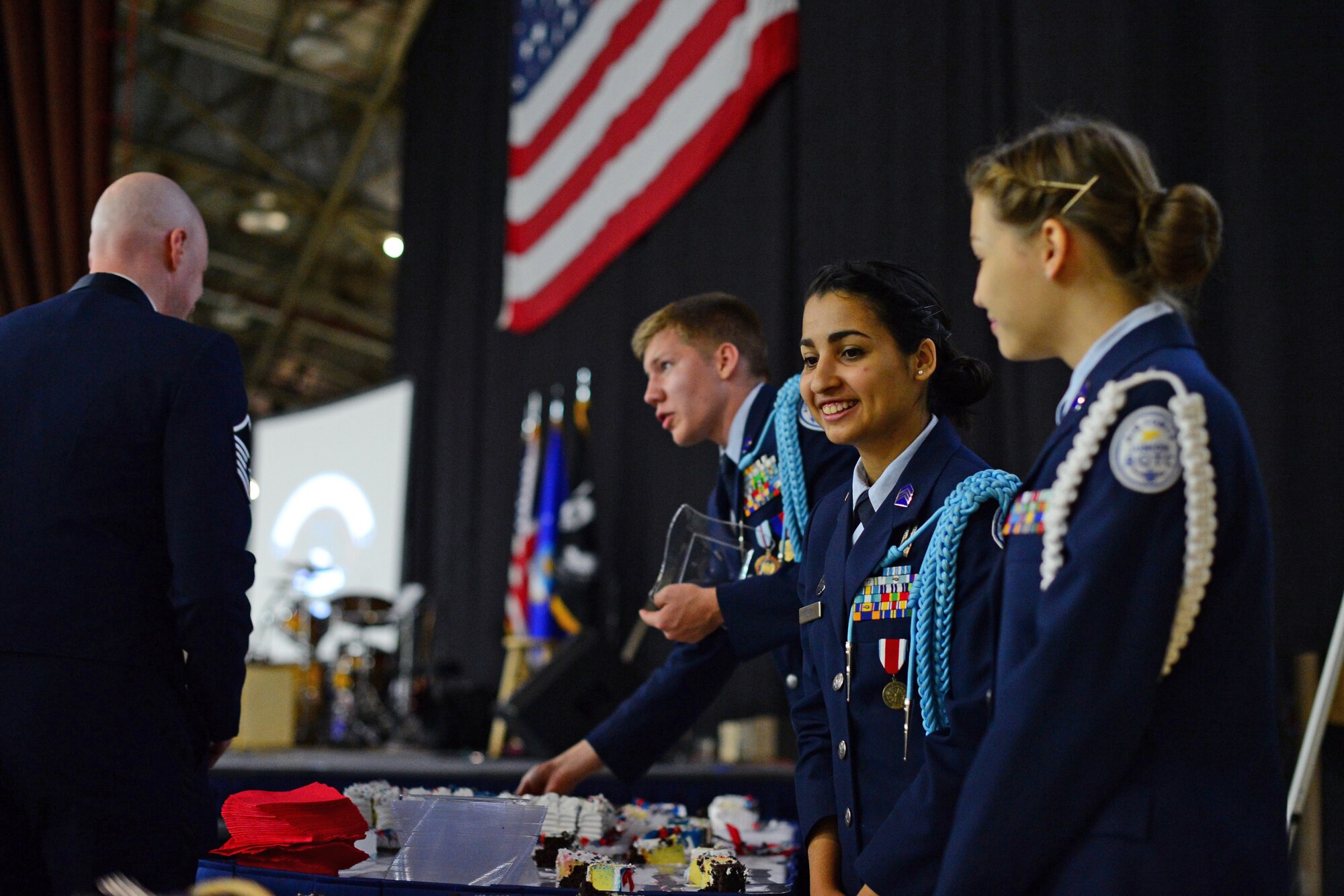 Members of the Junior Reserve Officer Training Corps serve cake during the Air Force Ball at Royal Air Force Lakenheath, England, Sept. 18, 2015. Spouses and Airmen from RAFs Lakenheath and Mildenhall, along with local RAF members, celebrated the Air Force’s 68th birthday in conjunction with the 75th anniversary of the Battle of Britain. (U.S. Air Force photo by Senior Airman Erin O’Shea/Released)
