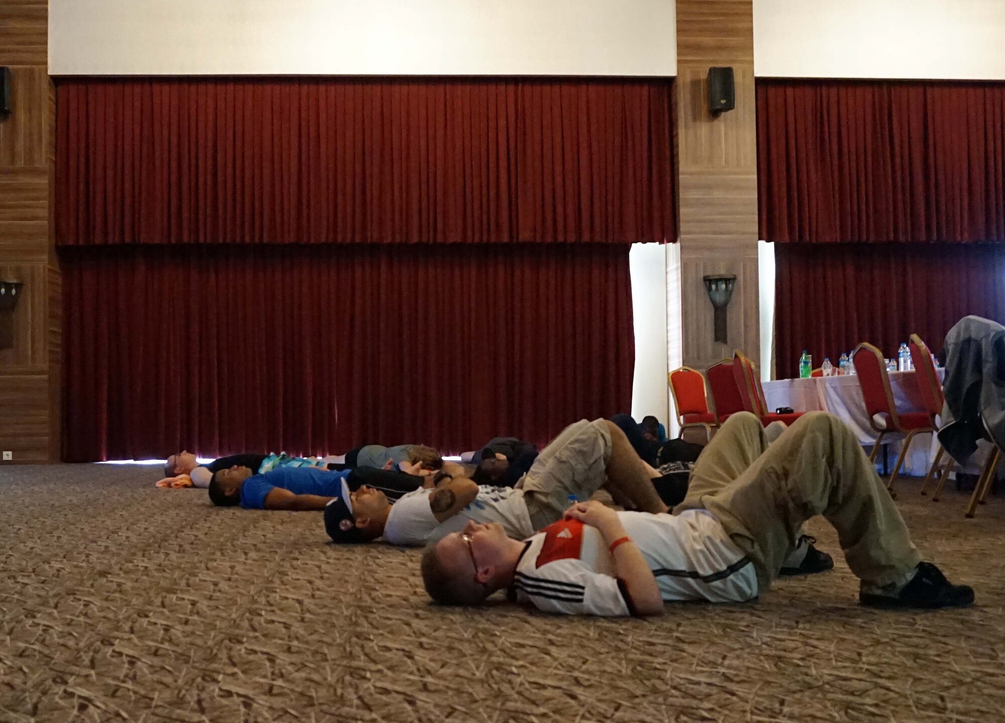 Airmen from the 39th Air Base Wing participate in a mediation activity during the RUfit Resiliency Retreat July 11, 2015, in Mersin, Turkey. Six master resiliency trainers attended the retreat to teach classes on coping skills, interpersonal problem solving and overall resiliency development. (Courtesy photo)