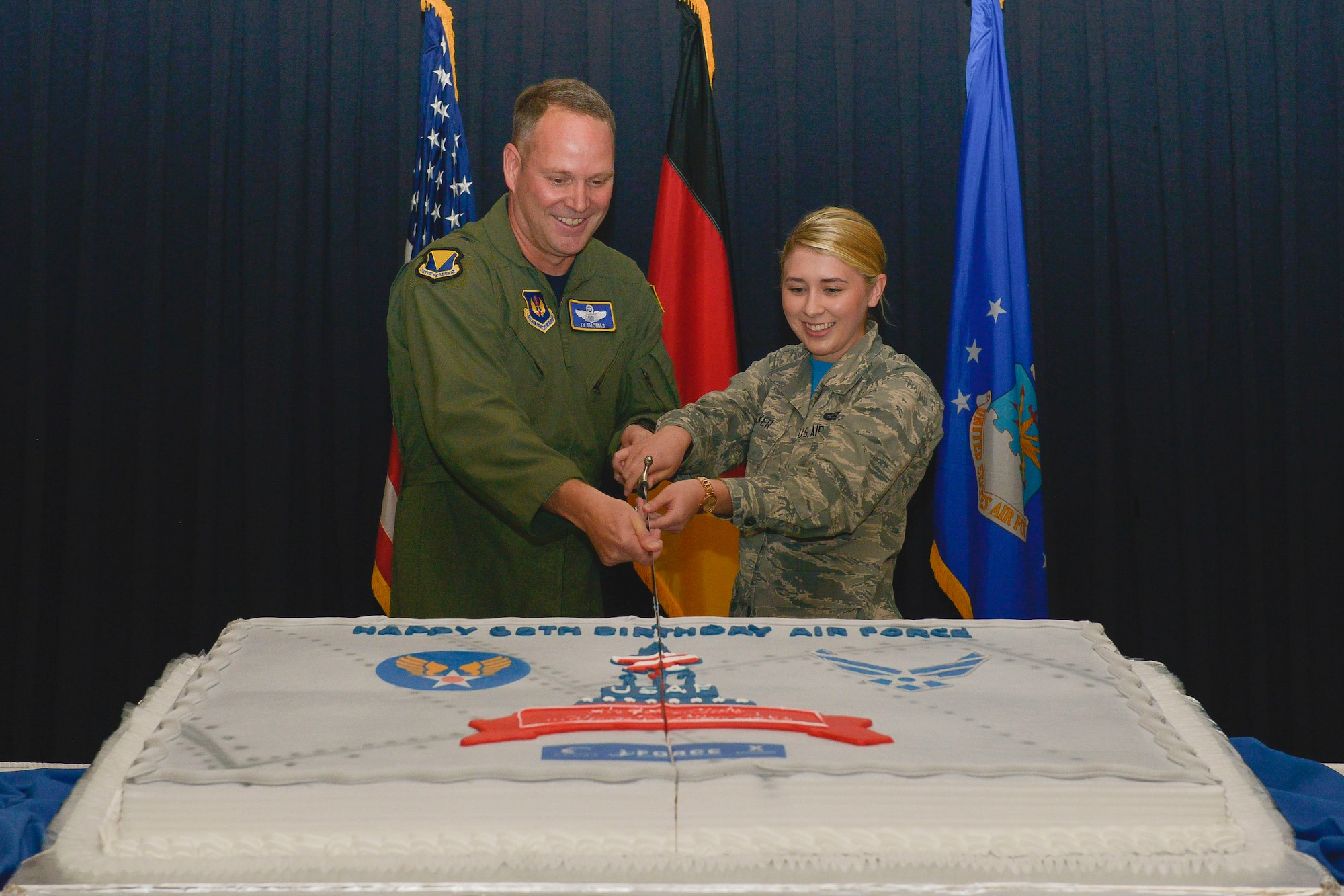 Brig. Gen. Jon T. Thomas, 86th Airlift Wing commander, and Airman Hannah Hacker, 786th Force Support Squadron retentions and separations technician, cut the celebratory cake during the 68th Air Force Birthday Cake-Cutting ceremony Sept. 18, 2015, at Ramstein Air Base, Germany. It is an Air Force tradition to celebrate the Air Force’s birthday by having the highest and lowest ranking Airmen cut a cake. 