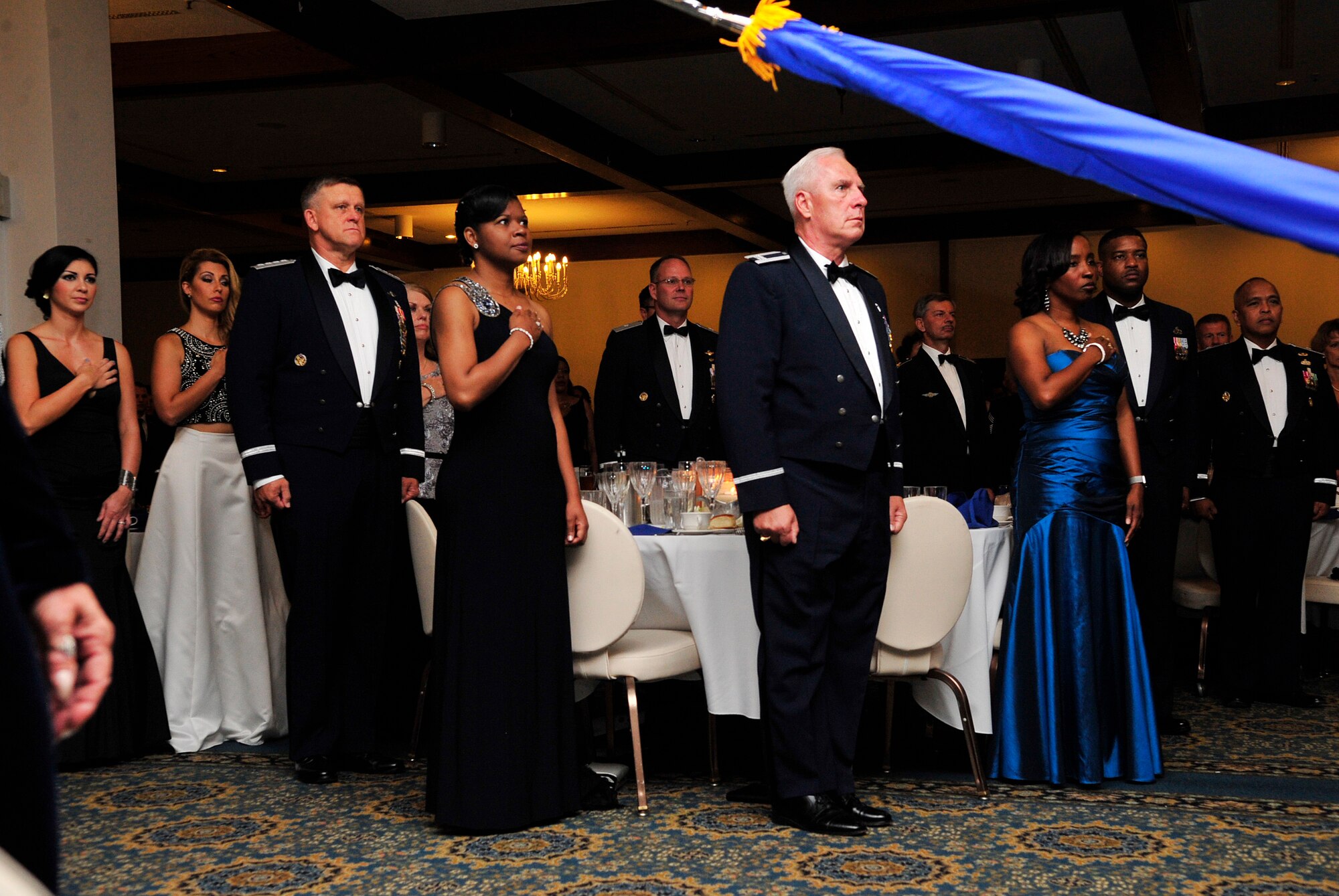 Air Force leaders and guests stand for the singing of both the German and American national anthems during the Air Force Ball Sept. 12, 2015, at Ramstein Air Base, Germany. The Air Force officially celebrated its 68th birthday as an independent branch on Sept 18, 2015. (U.S. Air Force photo/Airman 1st Class Larissa Greatwood)