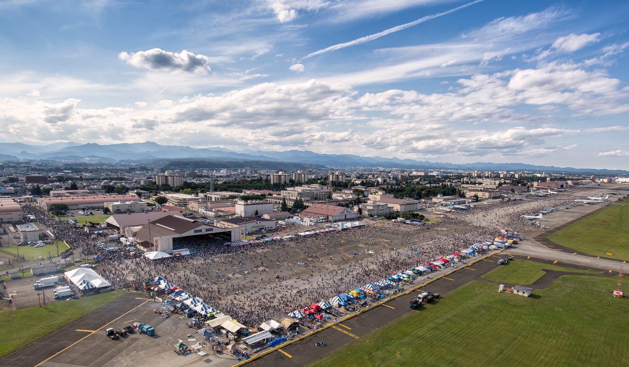 Tens of thousands of visitors crowd the flightily during the Japanese-American Friendship Festival at Yokota Air Base, Japan, Sept. 19, 2015. Yokota welcomed 185,000 visitors for the festival. (U.S. Air Force photo by Osakabe Yasuo/Released) 