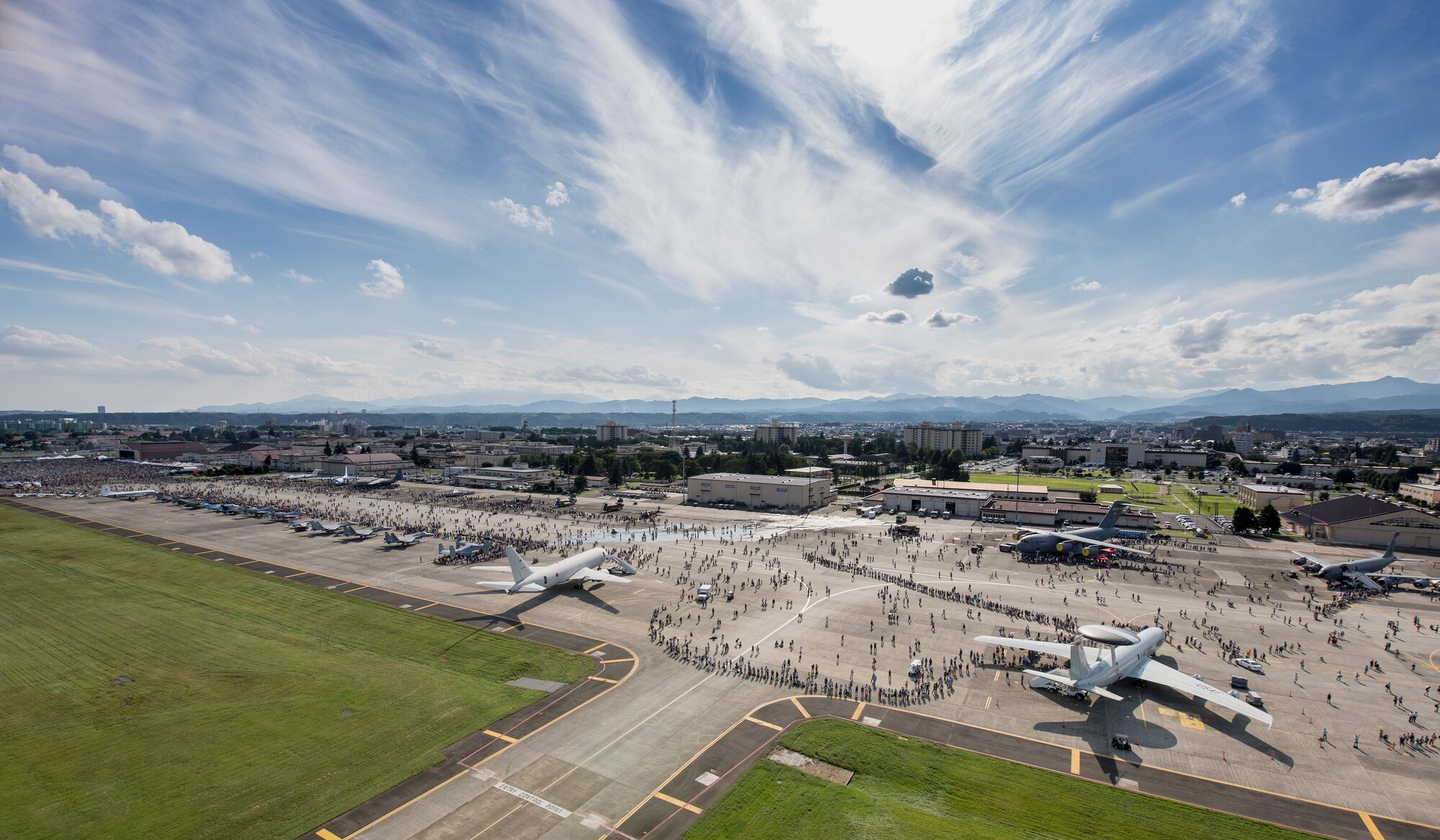 Tens of thousands of visitors crowd the flightily during the 2015 Japanese-American Friendship Festival at Yokota Air Base, Japan, Sept. 19, 2015. Yokota welcomed 185,000 visitors for the festival. (U.S. Air Force photo by Osakabe Yasuo/Released) 