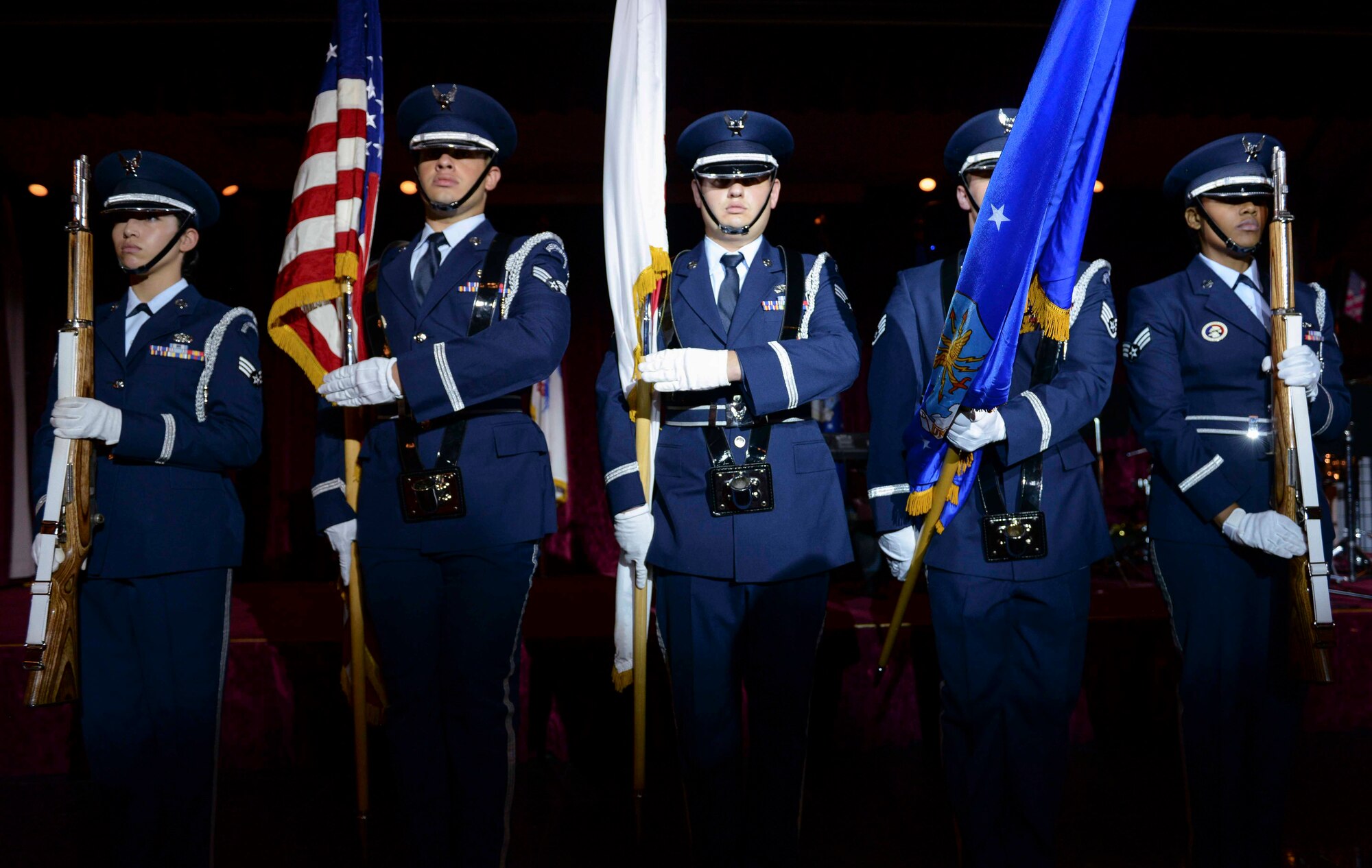 Airmen from the Kadena Air Base Honor Guard present the colors during the U.S. and Japanese national anthems preceding the 2015 Air Force Ball, Sept. 19, 2015, at the Rocker NCO club on Kadena Air Base, Japan. This year's theme, Honoring our past, preserving our future, celebrated the people and events that shaped the Air Force through its 68-year history. (U.S. Air Force photo by Senior Airman John Linzmeier)
