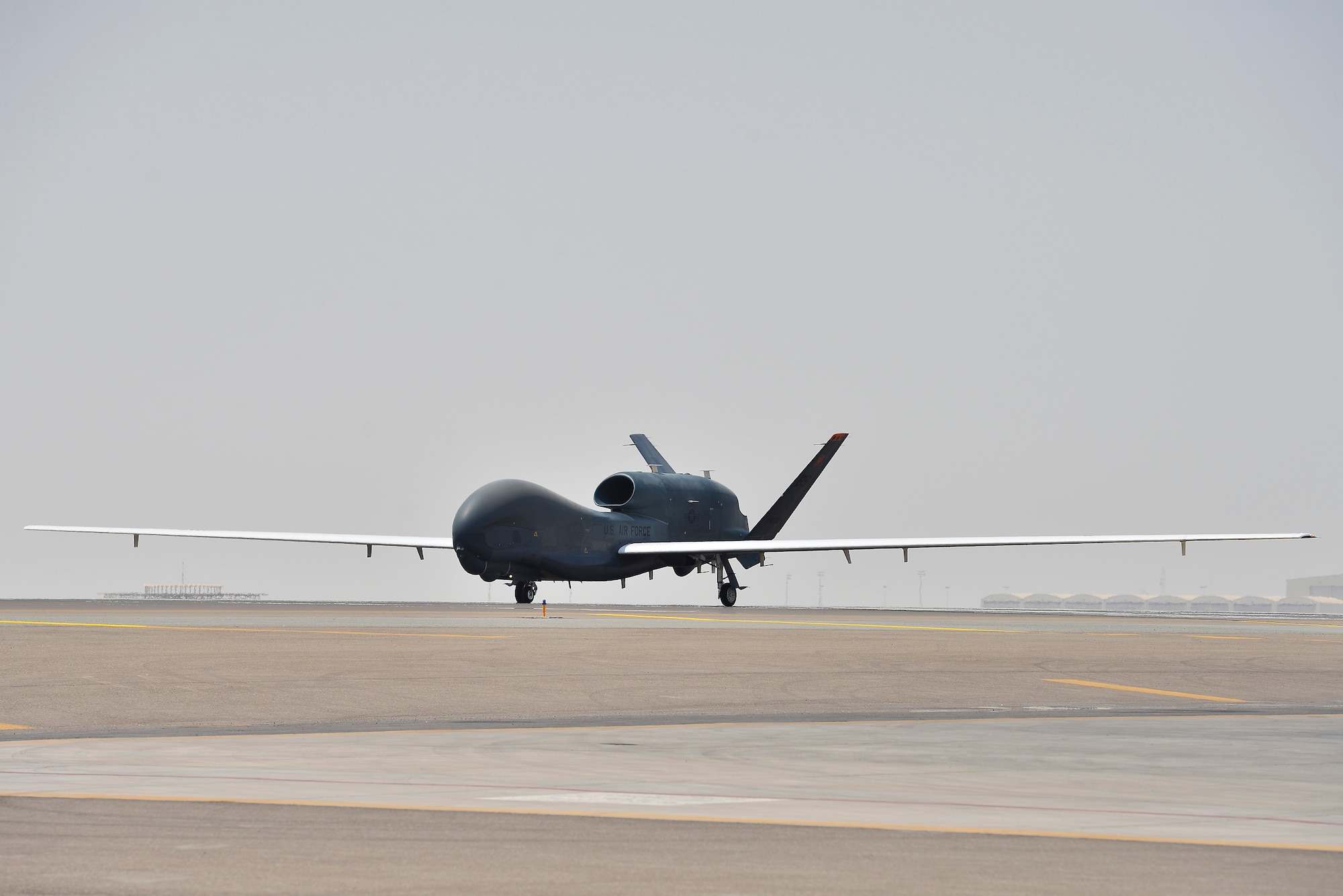An RQ-4 Global Hawk taxis on the flightline after a sortie an inspection at an undisclosed location in Southwest Asia September 18, 2015. (U.S. Air Force photo/Tech. Sgt. Christopher Boitz)