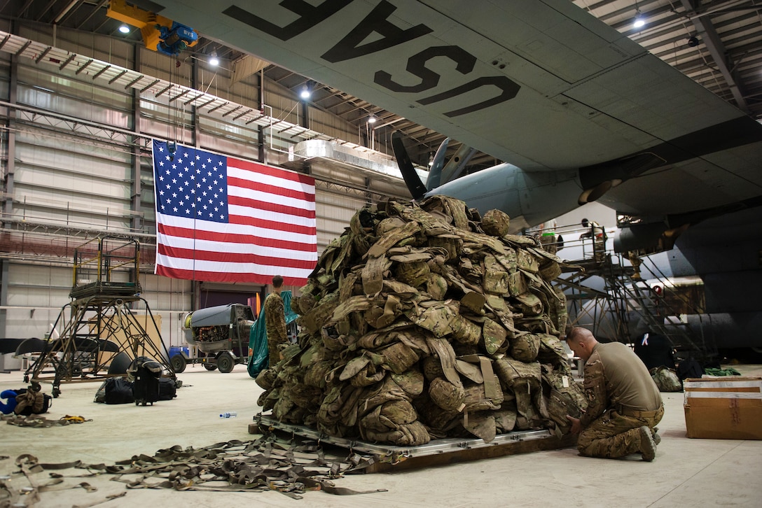 A U.S. airman prepares a pallet before it is loaded onto a C-130J Super Hercules aircraft on Bagram Airfield, Afghanistan, Sept. 12, 2015. The airman is assigned to the 774th Expeditionary Airlift Squadron. The squadron is in the process of redeploying back to Little Rock Air Force Base after successfully completing its deployment. U.S. Air Force photo by Tech. Sgt. Joseph Swafford
