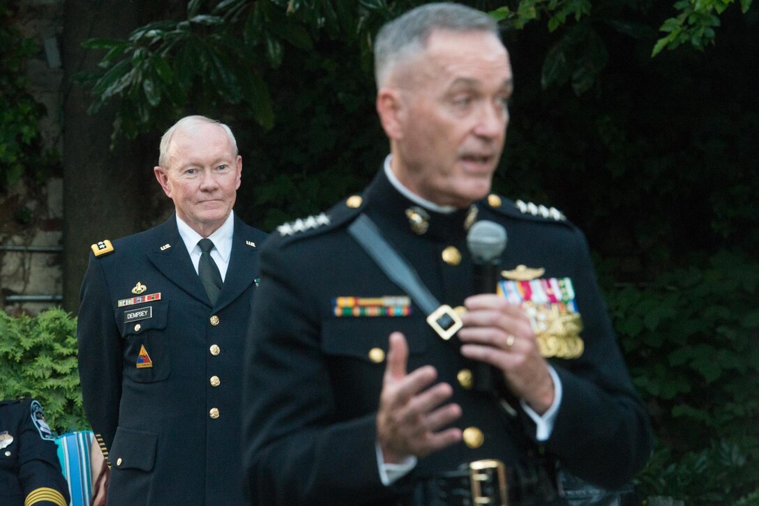 Marine Corps Gen. Joseph Dunford Jr.,the commandant of the Marine Corps, introduces Army Gen. Martin E. Dempsey, chairman of the Joint Chiefs of Staff, before an evening parade at the Marine Barracks in Washington, D.C., July 31, 2015. Dunford will succeed Dempsey as chairman this month. DOD photo by D. Myles Cullen