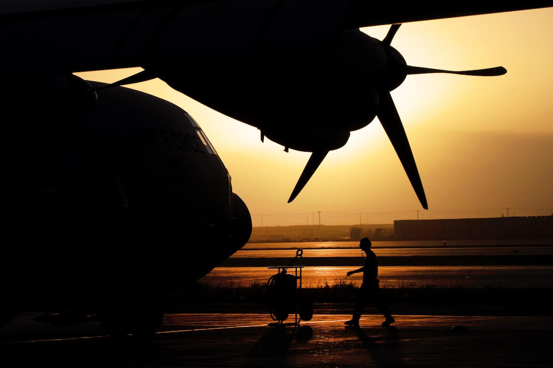A U.S. airman completes a preflight inspection on a C-130J Super Hercules aircraft on Bagram Airfield, Afghanistan, Sept. 12, 2015. U.S. Air Force photo by Tech. Sgt. Joseph Swafford