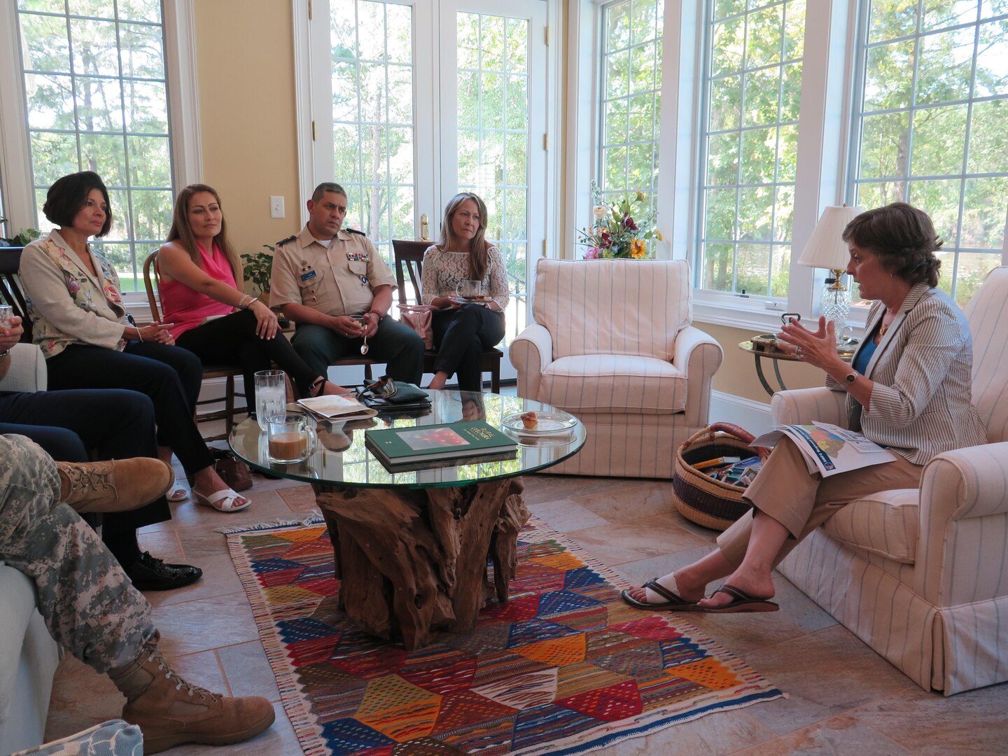 Barbara Livingston, wife of U.S. Army Maj. Gen. Robert E. Livingston, Jr., adjutant general for South Carolina, right, talks to Claudia Patricia Novoa, spouse of Colombian Air Force Maj. Gen. Ramses Rueda, chief of education for the Colombian Air Force and Durley Rocio Torrado Ortiz, spouse of Colombian Lt. Col.  Alcaro Enrique Gomez Franco at an informal gathering held at the Livingston's home, Sept. 8, 2015, near Columbia, S.C. The gathering between the S.C. National Guard spouses and state partnership program spouses from Colombia focused on their roles as spouses of military leaders and the various programs in the National Guard such as the U.S. "Yellow Ribbon Reintegration Program" that puts in place programs to help families before, during, and after a deployment.