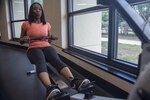 Latoya Marble, Air Force Personnel Center force support career field administrator, pulls the handle of a rowing machine during an indoor triathalon Sept. 18, 2015, at the Joint Base San Antonio-Randolph Rambler Fitness Center. The fitness event required participants to run, bike and row a total of 50 miles over a five-day period.
