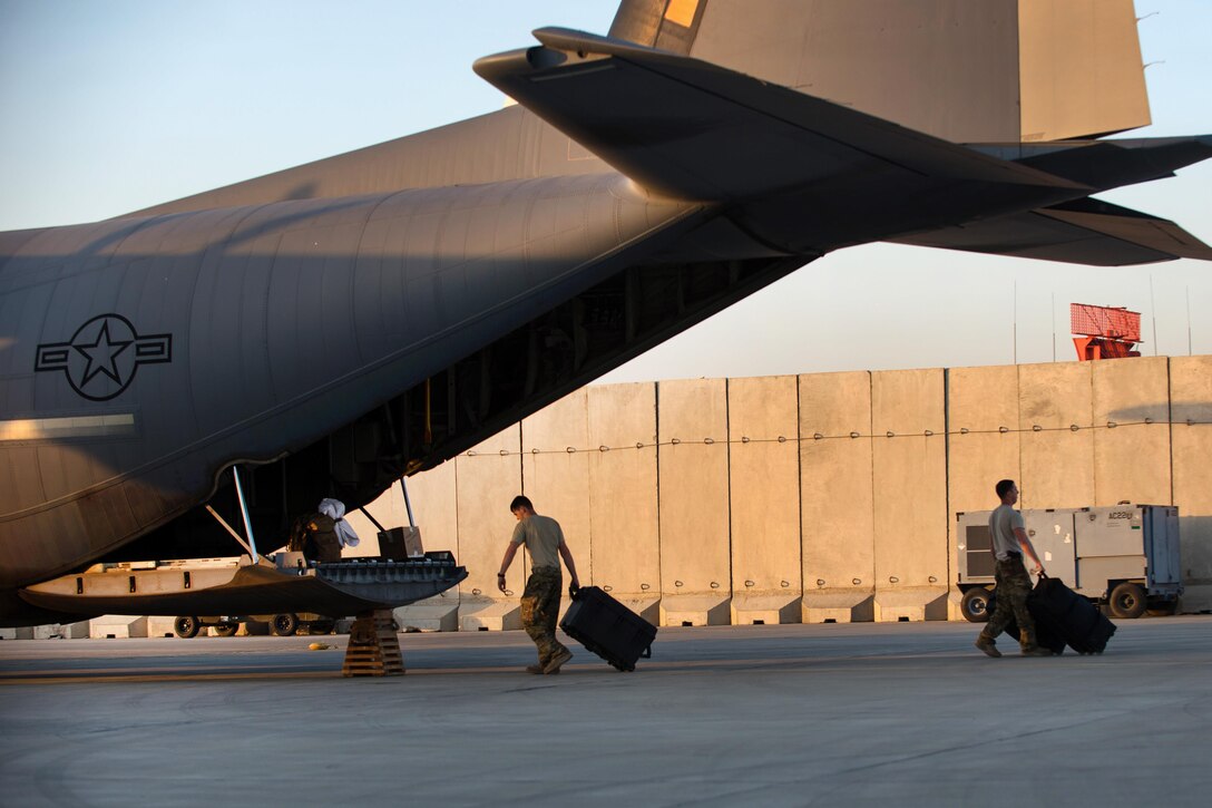 U.S. airmen load cargo onto a C-130J Super Hercules aircraft on Bagram Airfield, Afghanistan, Sept. 12, 2015. U.S. Air Force photo by Tech. Sgt. Joseph Swafford