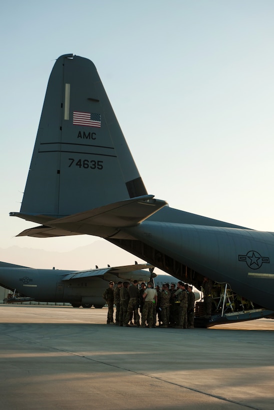 U.S. airmen have a preflight meeting outside of a C-130J Super Hercules aircraft on Bagram Airfield, Afghanistan, Sept. 12, 2015. U.S. Air Force photo by Tech. Sgt. Joseph Swafford 