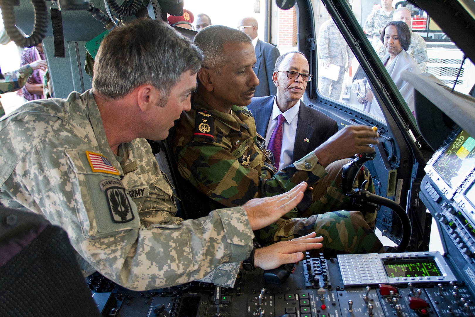 Chief Warrant Officer Kevin Keith discusses the capabilities of a UH-60 Black Hawk with Lt. Col. Chakib Mahamed Ali, deputy commander of the Djibouti Air Force, during a visit to the Kentucky Guard’s Army Aviation Support Facility in Frankfort, Kentucky, Sept. 15, 2015. Members of the Djibouti military toured several sites across Kentucky as part of the country’s new partnership with the Kentucky Guard. 