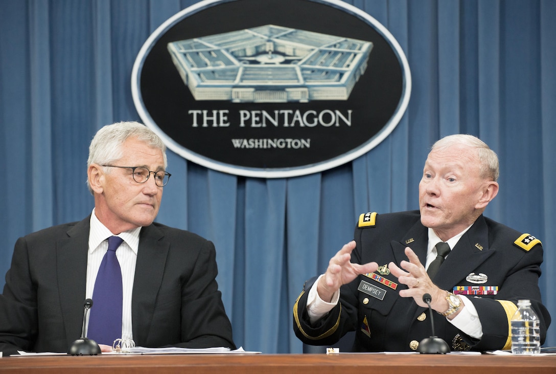 18th Chairman of the Joint Chiefs of Staff Gen. Martin E. Dempsey and Defense Secretary Chuck Hagel address the media in the Pentagon Briefing Room, Sept. 26, 2014. DoD photo by Army Staff Sgt. Sean K. Harp