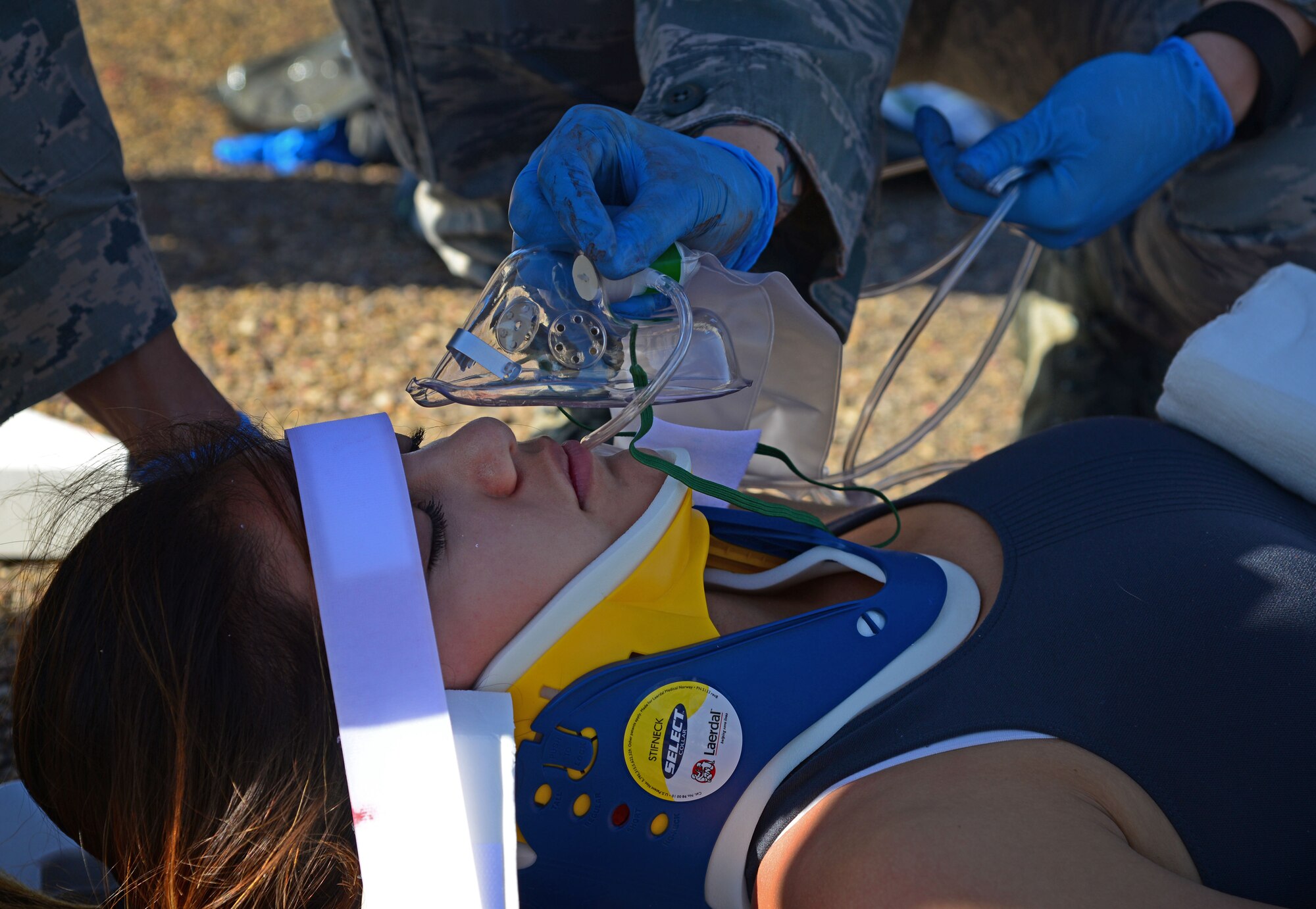 A member of the 27th Special Operations Medical Group is administered simulated care as an animal attack victim during the EMT Rodeo Sept. 17, 2015 at Cannon Air Force Base, N.M. Twenty-one teams of elite EMTs from 22 installations across the Air Force convened at Cannon for two days of innovative, high-octane competition Sept. 17-18. Throughout the rodeo teams were required to execute their lifesaving mission under the critical eye of expert evaluators, demonstrating accurate technique and effective implementation. (U.S. Air Force photo/Staff Sgt. Alexx Pons)