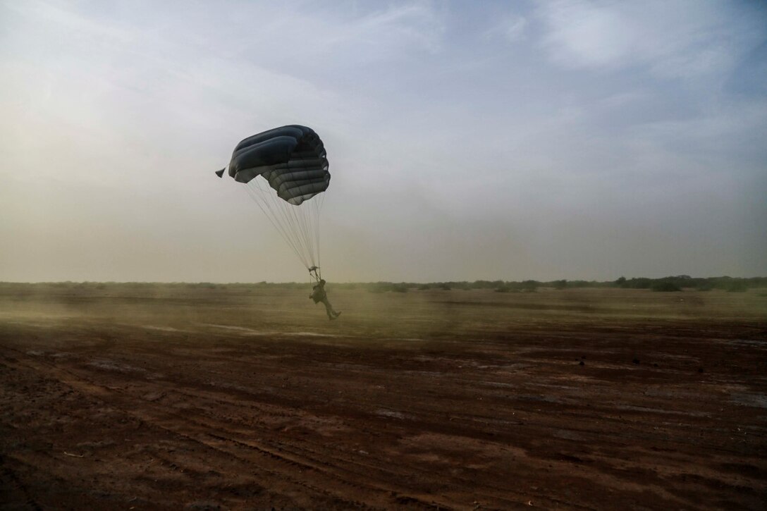 CAMP LEMONNIER, Djibouti (Sept. 14, 2015) A U.S. Marine with the 15th Marine Expeditionary Unit’s Force Reconnaissance Detachment parachutes out of a French C-160. Elements of the 15th MEU are conducting bilateral training with the 5th Overseas Combined Arms Regiment (RIAOM) and other French forces in Djibouti in order to improve interoperability between the MEU and the French military. (U.S. Marine Corps photo by Sgt. Steve H. Lopez/Released