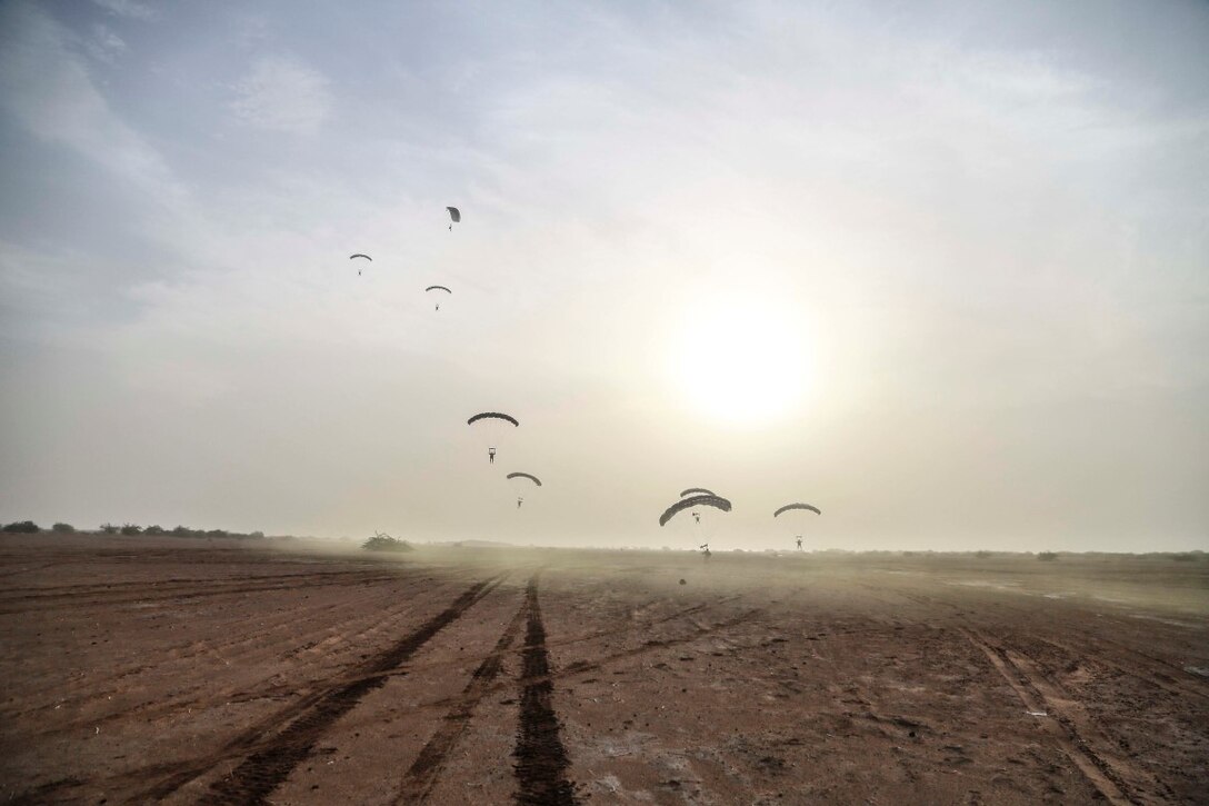 CAMP LEMONNIER, Djibouti (Sept. 14, 2015) U.S. Marines with the 15th Marine Expeditionary Unit, Force Reconnaissance Detachment parachute out of a French C-160. Elements of the 15th MEU are conducting bilateral training with the 5th Overseas Combined Arms Regiment (RIAOM) and other French forces in Djibouti in order to improve interoperability between the MEU and the French military. (U.S. Marine Corps photo by Sgt. Steve H. Lopez/Released)