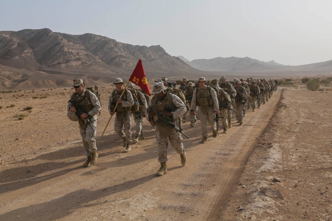 SOUTHWEST ASIA (Sept. 16, 2015)  U.S. Marines with India Company, Battalion Landing Team 3rd Battalion, 1st Marine Regiment, 15th Marine Expeditionary Unit, hike to a range to conduct squad attacks during a bi-lateral training exercise. The 15th MEU, embarked aboard the ships of the Essex Amphibious Ready Group, is a forward-deployed, flexible sea-based Marine air-ground task force capable of engaging with regional partners and maintaining regional security. (U.S. Marine Corps photo by Sgt. Jamean Berry/Released)