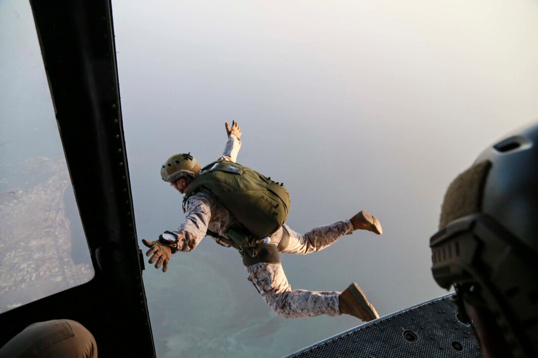 CAMP LEMONNIER, Djibouti (Sept. 16, 2015) U.S. Marine Gunnery Sgt. Matthew Rawson parachutes out of a UH-1Y Venom from Marine Medium Tiltrotor Squadron 161 (Reinforced). Rawson is a team leader with the 15th Marine Expeditionary Unit’s Force Reconnaissance Detachment. Elements of the 15th MEU are conducting bilateral training with the 5th Overseas Combined Arms Regiment (RIAOM) and French paratroopers in Djibouti in order to improve interoperability between the MEU and the French military. (U.S. Marine Corps photo by Sgt. Steve H. Lopez/Released)