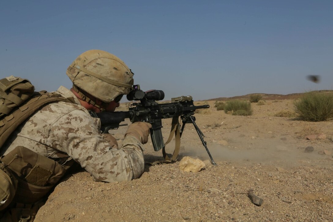 SOUTHWEST ASIA (Sept. 17, 2015) U.S. Marine Lance Cpl. Garret Cook fires an infantry automatic rifle during a bi-lateral training exercise. Cook is an IAR gunner with India Company, Battalion Landing Team 3rd Battalion, 1st Marine Regiment, 15th Marine Expeditionary Unit. The 15th MEU, embarked aboard the ships of the Essex Amphibious Ready Group, is a forward-deployed, flexible sea-based Marine air-ground task force capable of engaging with regional partners and maintaining regional security. (U.S. Marine Corps photo by Sgt. Jamean Berry/Released)