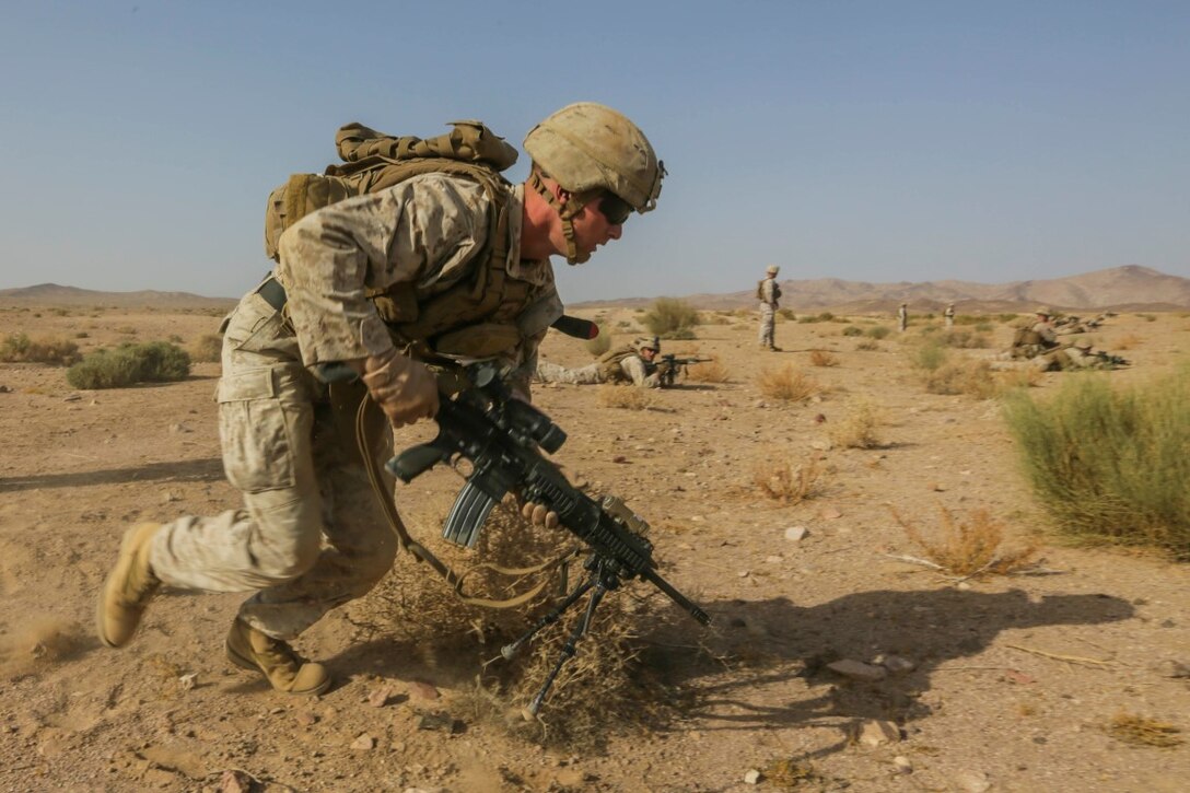 SOUTHWEST ASIA (Sept. 17, 2015) U.S. Marine Lance Cpl. Garret Cook moves to his next firing position during a bi-lateral training exercise. Cook is an infantry automatic rifle gunner with India Company, Battalion Landing Team 3rd Battalion, 1st Marine Regiment, 15th Marine Expeditionary Unit. The 15th MEU, embarked aboard the ships of the Essex Amphibious Ready Group, is a forward-deployed, flexible sea-based Marine air-ground task force capable of engaging with regional partners and maintaining regional security. (U.S. Marine Corps photo by Sgt. Jamean Berry/Released)