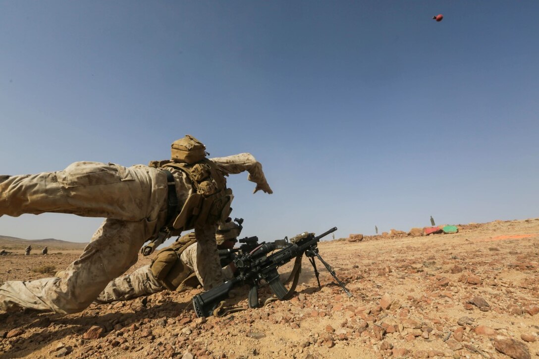 SOUTHWEST ASIA (Sept. 17, 2015) U.S. Marine Lance Cpl. Garret Cook throws a practice grenade during a bi-lateral training exercise. Cook is an infantry automatic rifle gunner with India Company, Battalion Landing Team 3rd Battalion, 1st Marine Regiment, 15th Marine Expeditionary Unit. The 15th MEU, embarked aboard the ships of the Essex Amphibious Ready Group, is a forward-deployed, flexible sea-based Marine air-ground task force capable of engaging with regional partners and maintaining regional security. (U.S. Marine Corps photo by Sgt. Jamean Berry/Released)