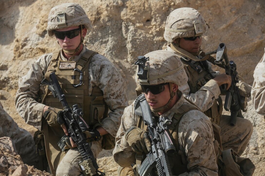 SOUTHWEST ASIA (Sept. 17, 2015) U.S. Marine Lance Cpl. Cody Baker, Lance Cpl. Jerimiah Lance, and Lance Cpl. Brandon Garcia provide security in a trench during a bi-lateral training exercise. Baker, Lance, and Garcia are riflemen with India Company, Battalion Landing Team 3rd Battalion, 1st Marine Regiment, 15th Marine Expeditionary Unit. The 15th MEU, embarked aboard the ships of the Essex Amphibious Ready Group, is a forward-deployed, flexible sea-based Marine air-ground task force capable of engaging with regional partners and maintaining regional security. (U.S. Marine Corps photo by Sgt. Jamean Berry/Released)