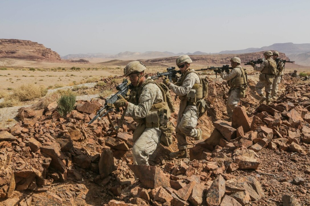 SOUTHWEST ASIA (Sept. 17, 2015) U.S. Marines with India Company, Battalion Landing Team 3rd Battalion, 1st Marine Regiment, 15th Marine Expeditionary Unit, clear a trench during a bi-lateral training exercise. The 15th MEU, embarked aboard the ships of the Essex Amphibious Ready Group, is a forward-deployed, flexible sea-based Marine air-ground task force capable of engaging with regional partners and maintaining regional security. (U.S. Marine Corps photo by Sgt. Jamean Berry/Released)