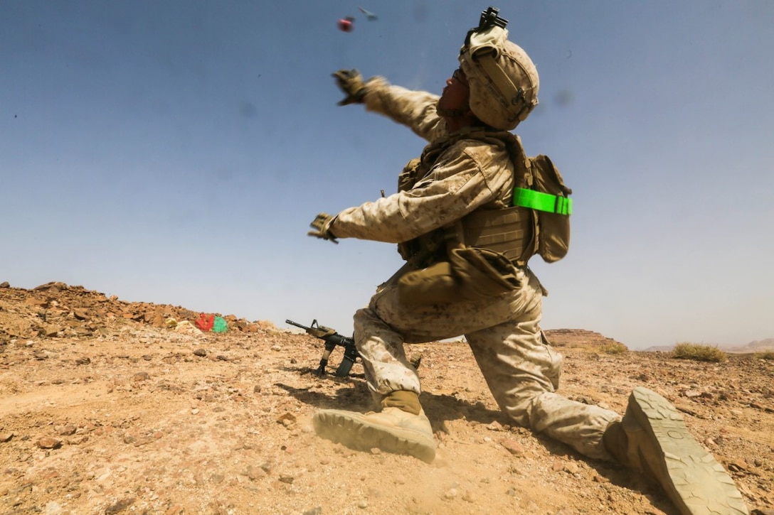 SOUTHWEST ASIA (Sept. 17, 2015) U.S. Marine Lance Cpl. Mainray Ho throws a practice grenade during a bi-lateral training exercise. Ho is a rifleman with India Company, Battalion Landing Team 3rd Battalion, 1st Marine Regiment, 15th Marine Expeditionary Unit. The 15th MEU, embarked aboard the ships of the Essex Amphibious Ready Group, is a forward-deployed, flexible sea-based Marine air-ground task force capable of engaging with regional partners and maintaining regional security. (U.S. Marine Corps photo by Sgt. Jamean Berry/Released)