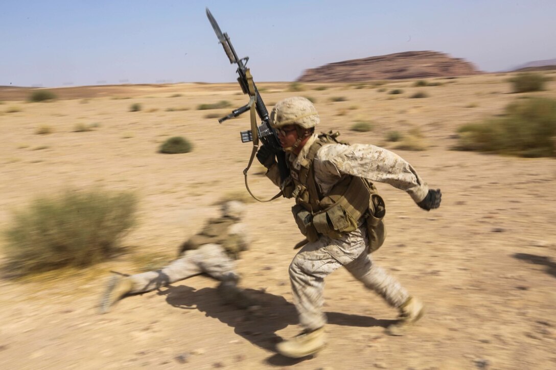 SOUTHWEST ASIA (Sept. 17, 2015) U.S. Marine Lance Cpl. Jonathan Ripoyla moves to his next firing position during a bi-lateral training exercise. Ripoyla is a rifleman with India Company, Battalion Landing Team 3rd Battalion, 1st Marine Regiment, 15th Marine Expeditionary Unit. The 15th MEU, embarked aboard the ships of the Essex Amphibious Ready Group, is a forward-deployed, flexible sea-based Marine air-ground task force capable of engaging with regional partners and maintaining regional security. (U.S. Marine Corps photo by Sgt. Jamean Berry/Released)