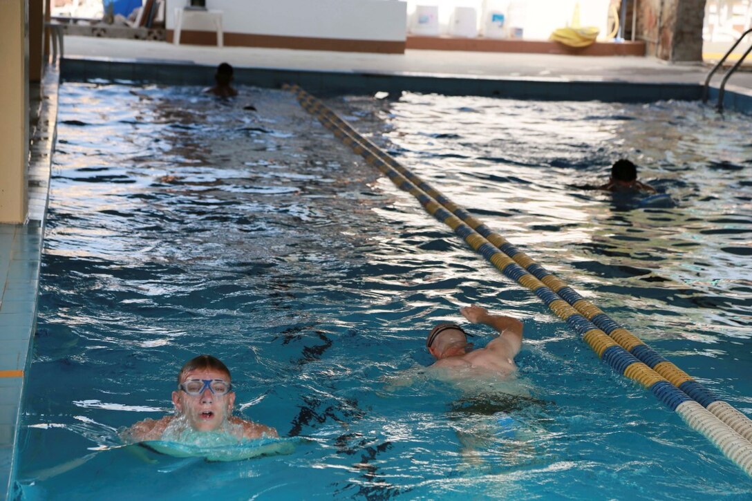 CAMP LEMONNIER, Djibouti (Sept. 19, 2015) U.S. Marines with Delta Company, Light Armored Reconnaissance Detachment, 15th Marine Expeditionary Unit, swim laps during water-conditioning training. The Marines were preparing for a survival course and combat training with members of the French military in Djibouti. Elements of the 15th MEU are preparing to conduct bilateral training with the 5th Overseas Combined Arms Regiment (RIAOM) in Djibouti in order to improve interoperability between the MEU and the French military. (U.S. Marine Corps photo by Sgt. Steve H. Lopez/Released)